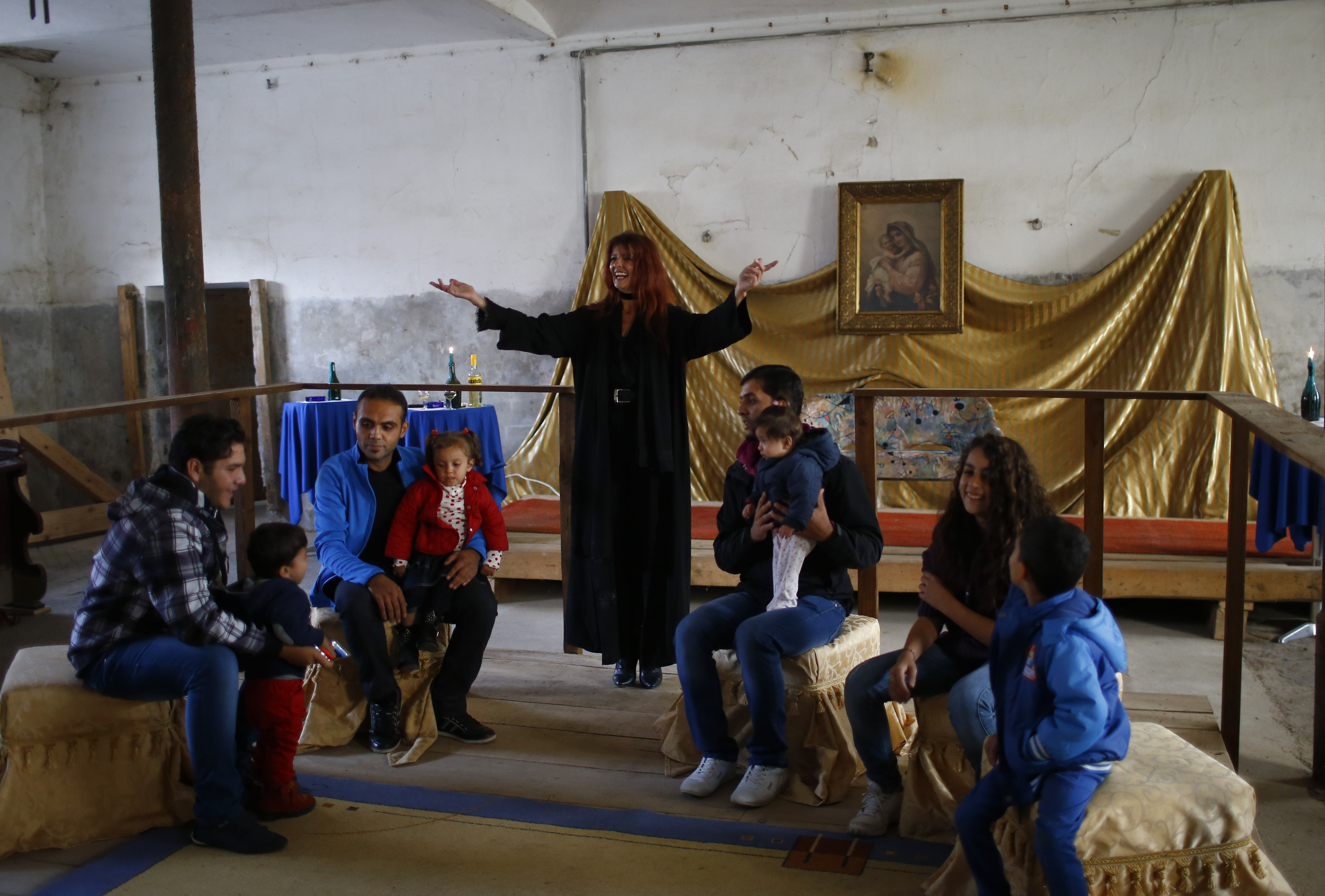 Refugees celebrate Eid al-Adha with Austrian villager Sabine Schoeller-Lamberty (C) in the hall of Schloss Koenigshof, an ancient Habsburg castle in Bruckneudorf, Austria