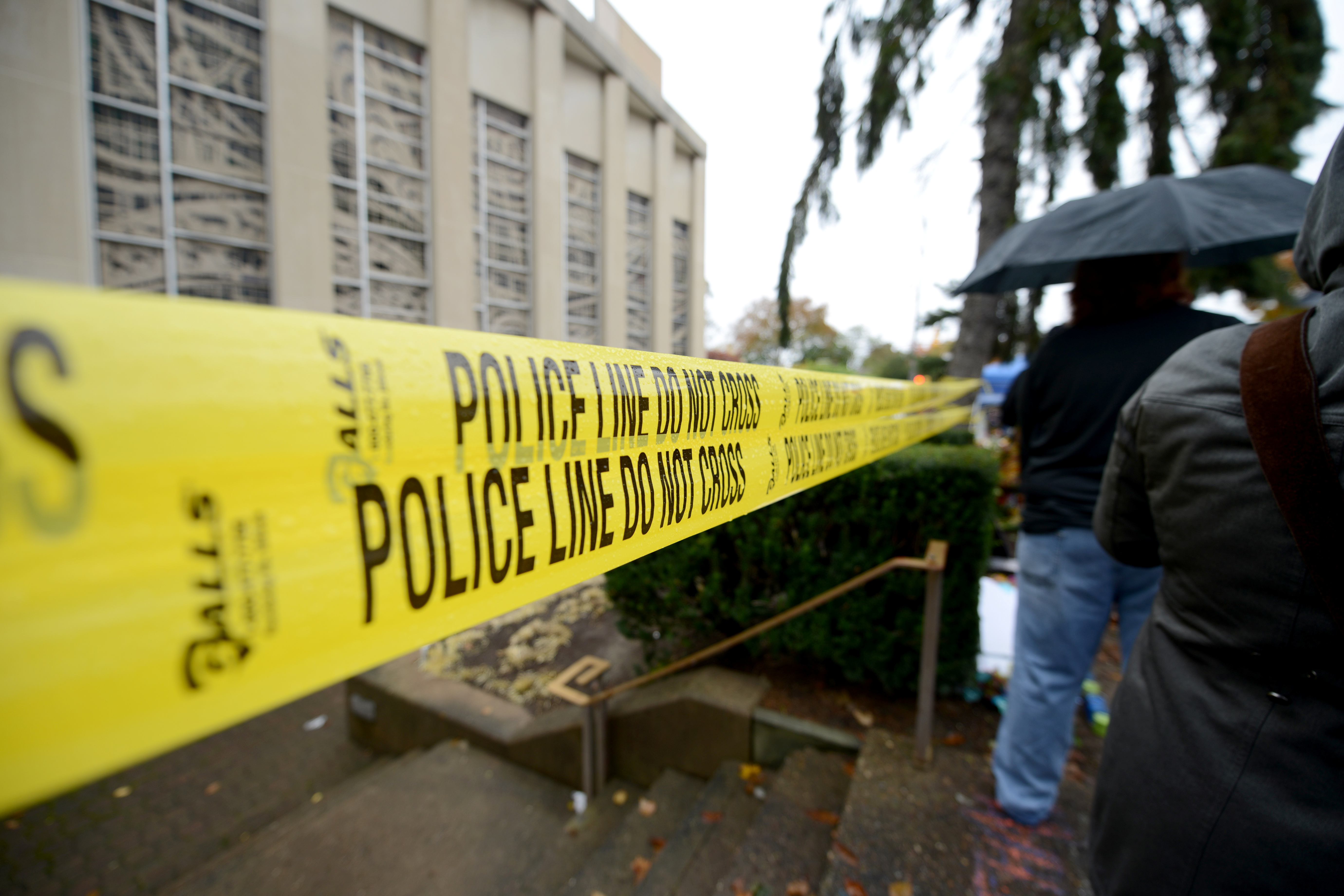 Yellow police tape sits stretched across the outside of a Pittsburgh synagogue.