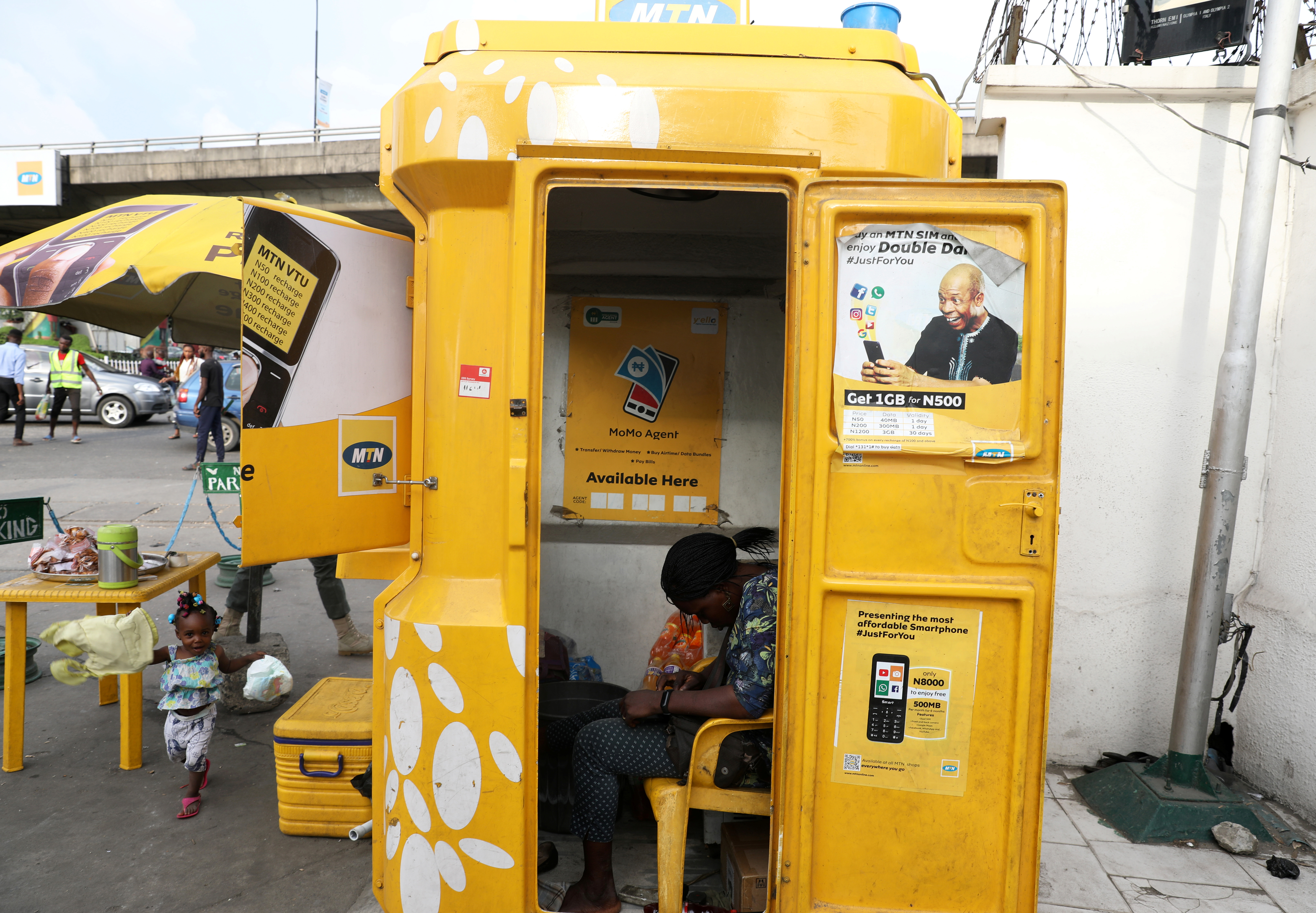 A vendor selling airtime and other services waits for customers at an MTN Telecom shop in Lagos, Nigeria on August 28, 2019