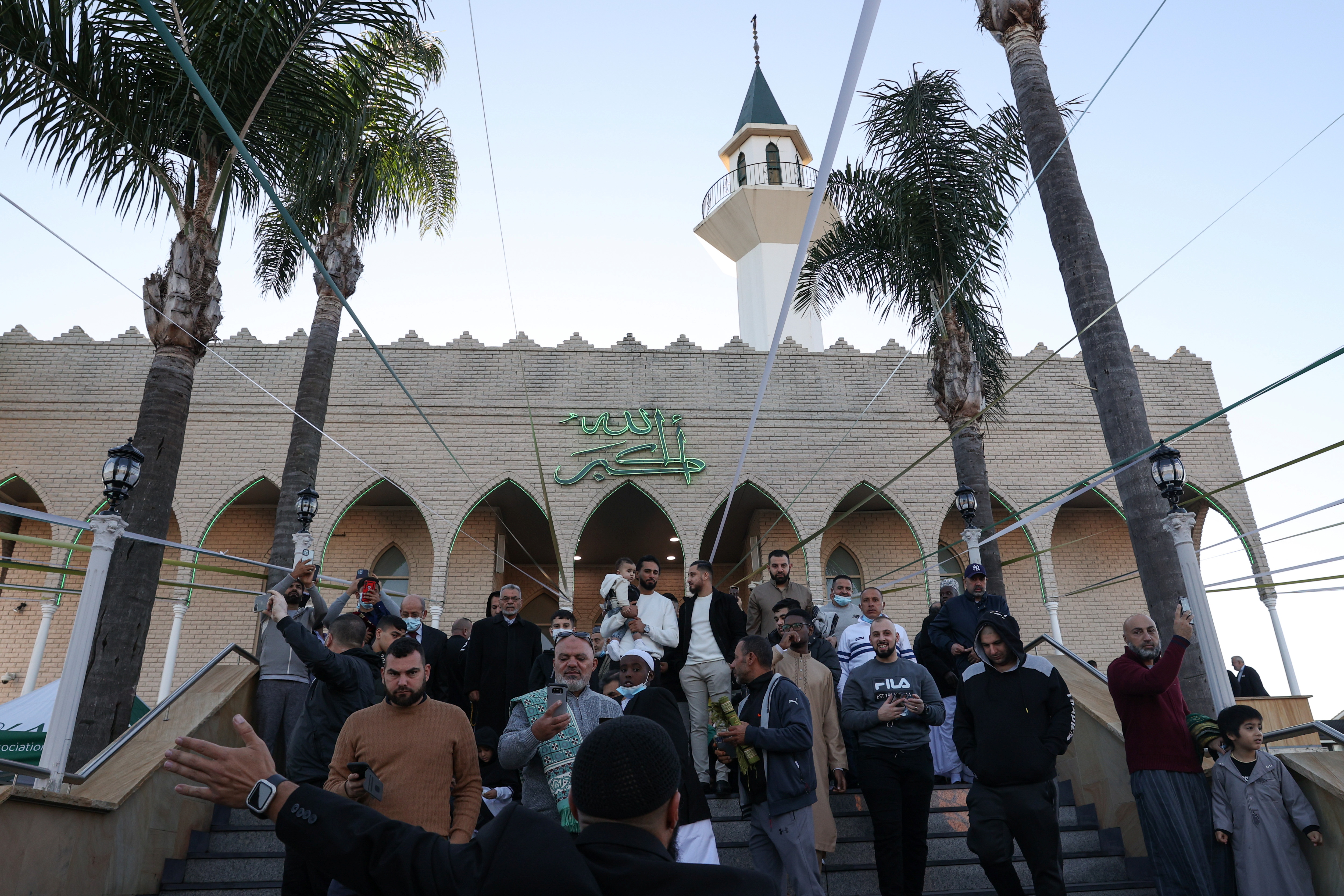 Muslim worshippers depart Lakemba Mosque after observing the morning Eid prayer in the Lakemba suburb of Sydney, Australia