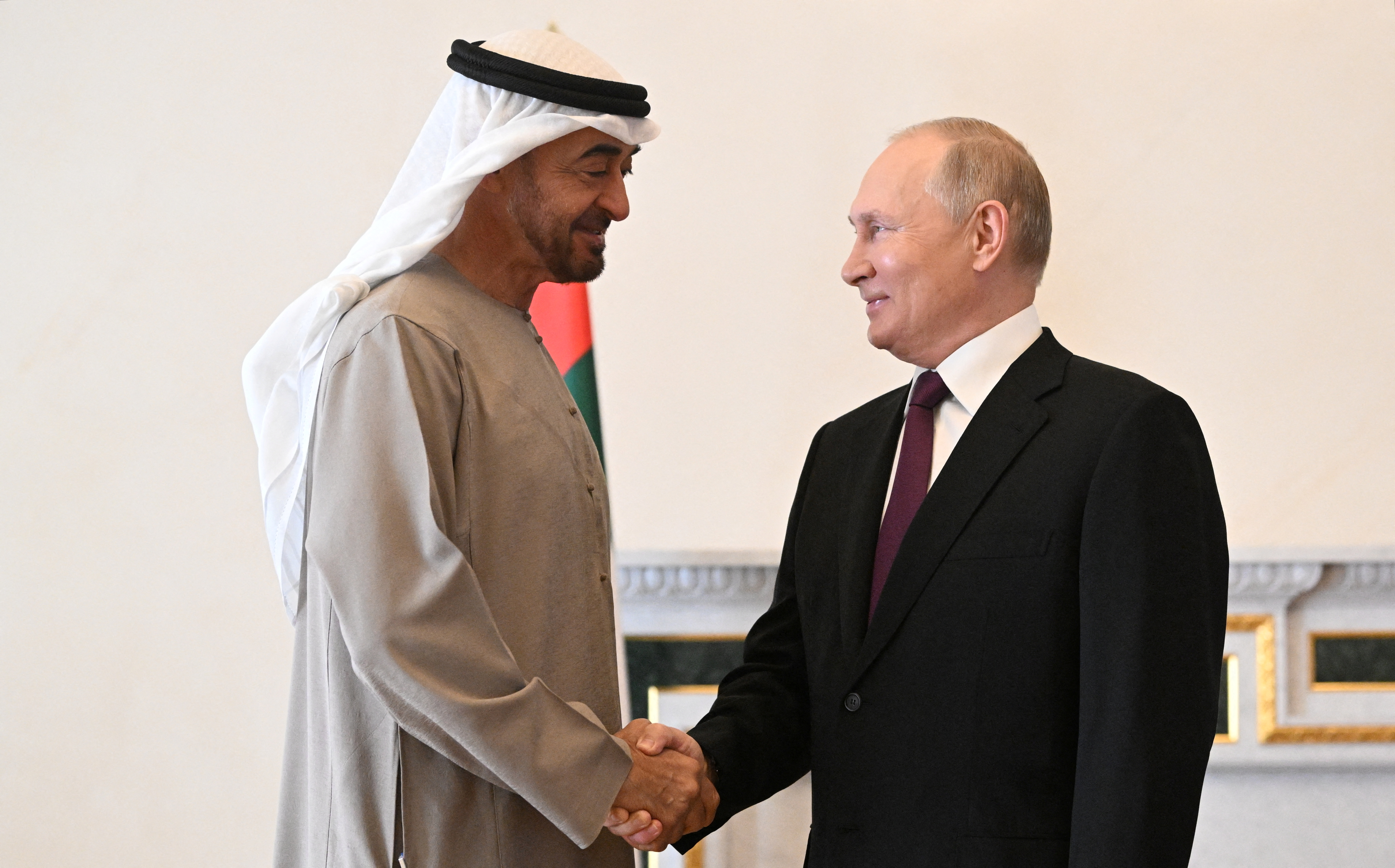 Russia's President Vladimir Putin shakes hands with United Arab Emirates' President Sheikh Mohammed bin Zayed al-Nahyan