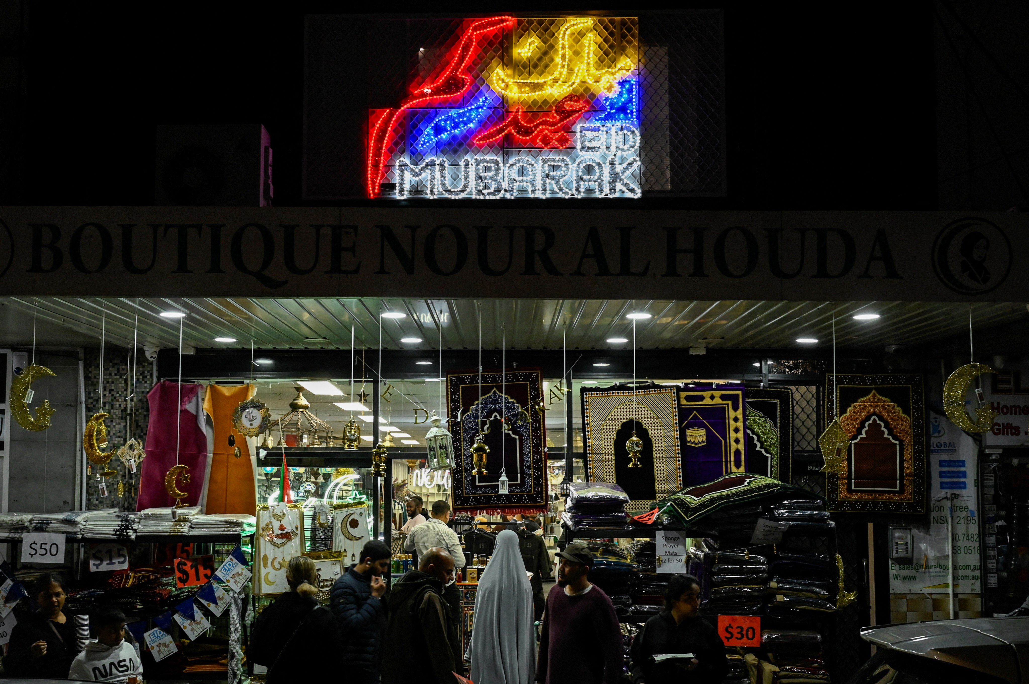 People shop during Eid in the suburb of Lakemba in Sydney, Australia