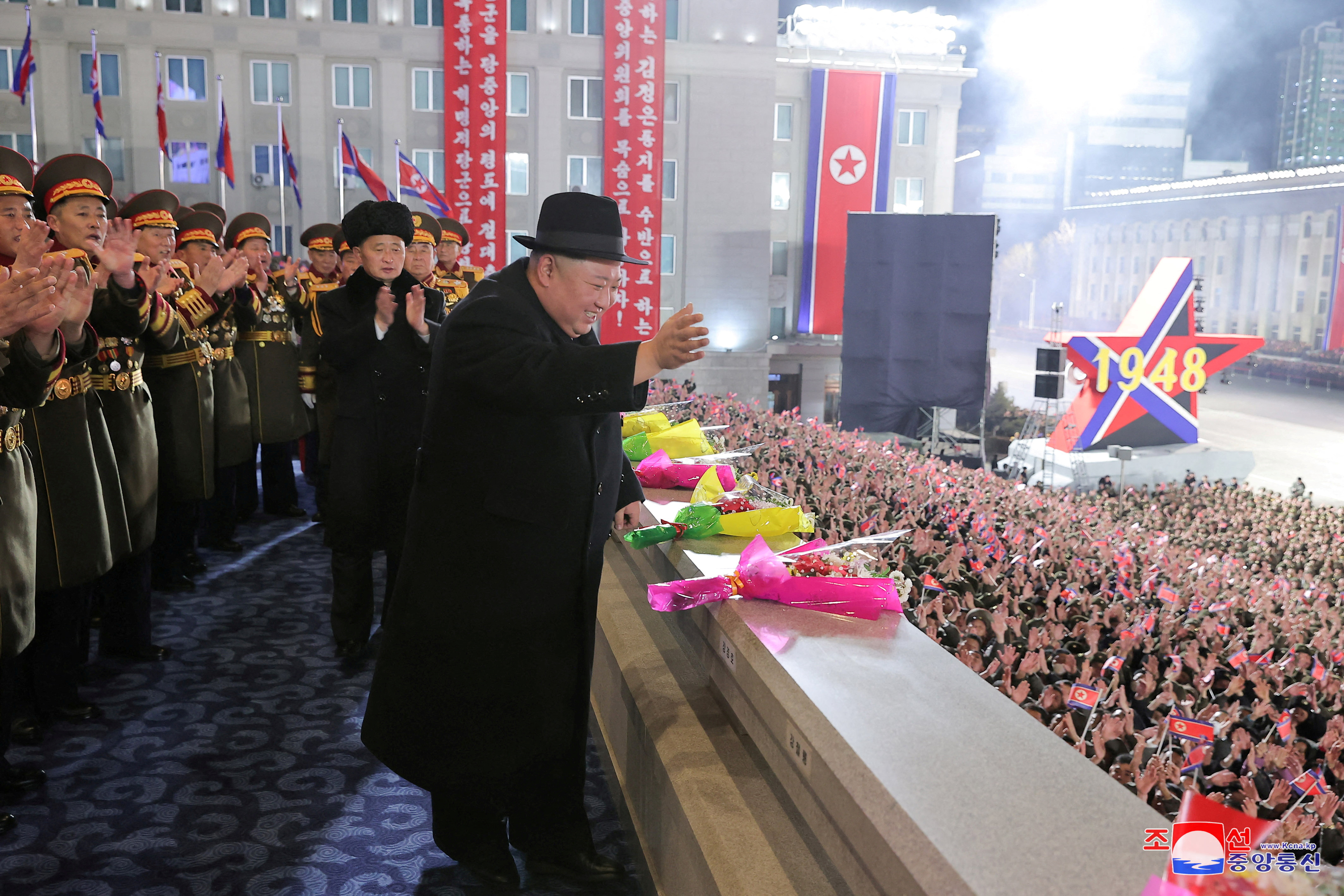 North Korean leader Kim Jong Un greets the crowd during a military parade to mark the 75th founding anniversary of North Korea's army, at Kim Il Sung Square in Pyongyang, North Korea February 8, 2023