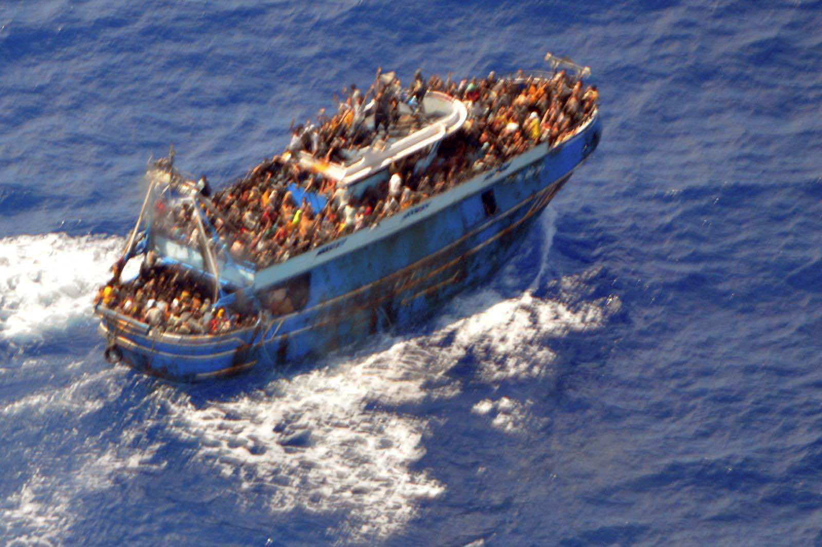 A undated handout photo provided by the Hellenic Coast Guard shows migrants onboard a boat during a rescue operation, before their boat capsized on the open sea, off Greece, June 14, 2023