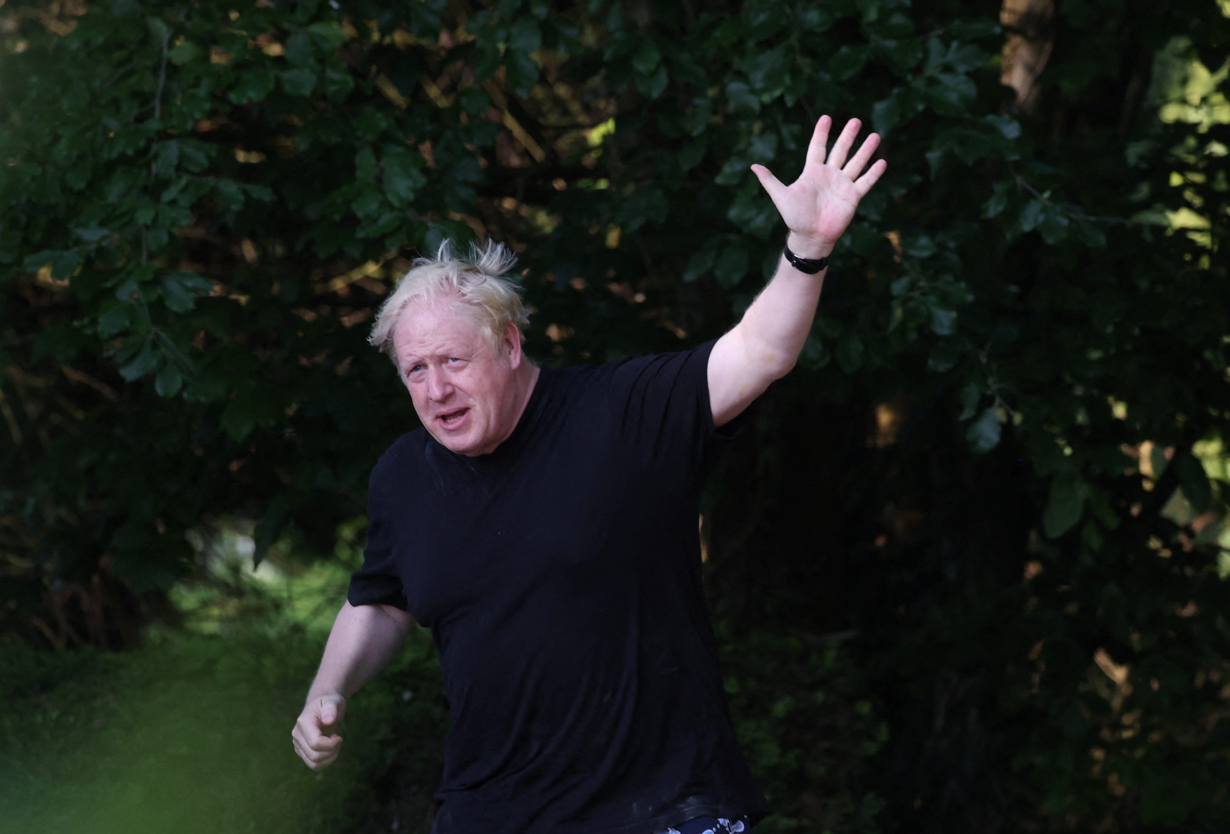 Former British Prime Minister Boris Johnson gestures as he runs near his home in Brightwell-cum-Sotwell, Oxfordshire, Britain, June 15, 2023. REUTERS/Toby Melville