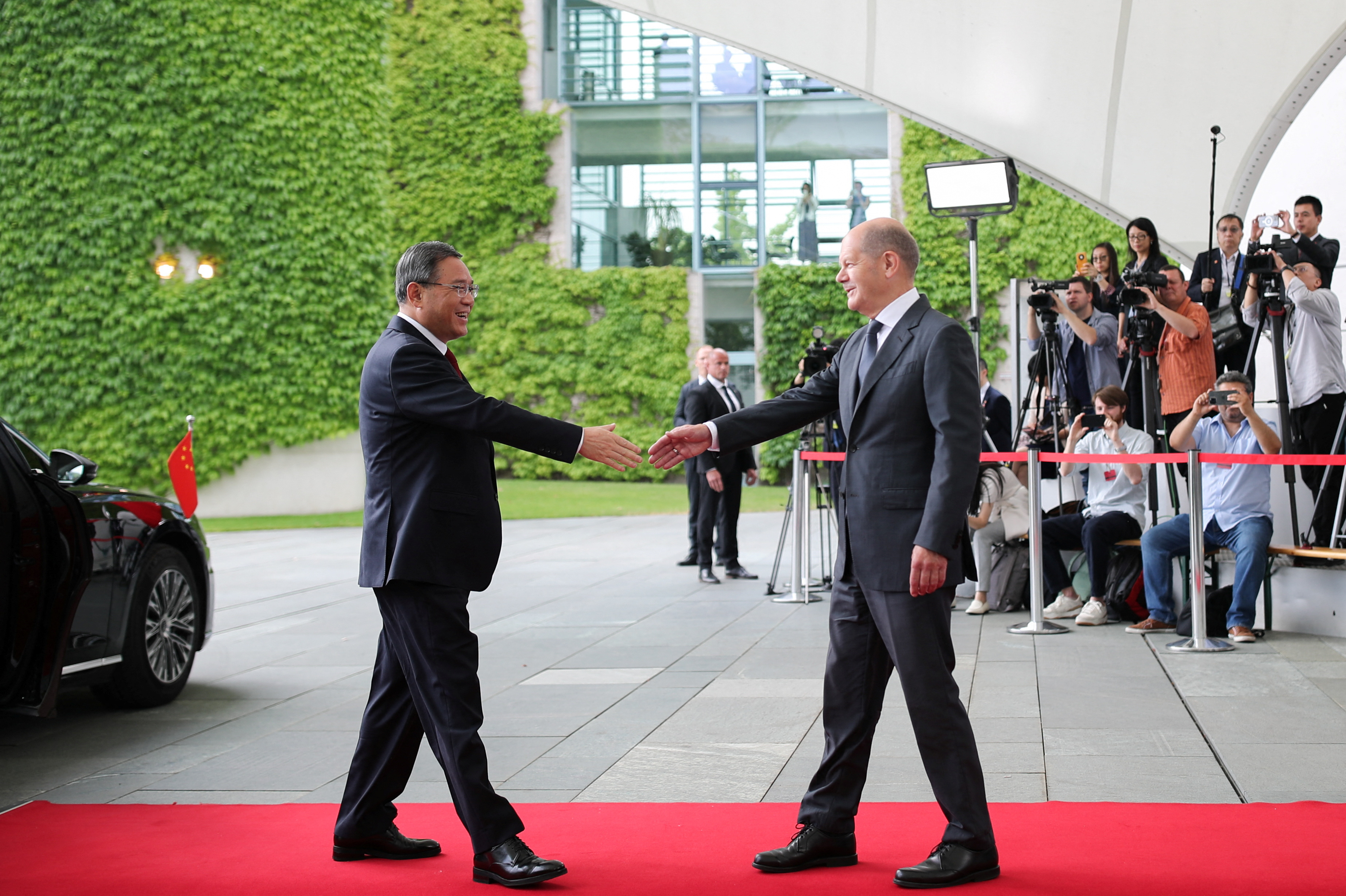 German Chancellor Olaf Scholz greets Chinese Premier Li Qiang on the day of German-Chinese government consultations in Berlin