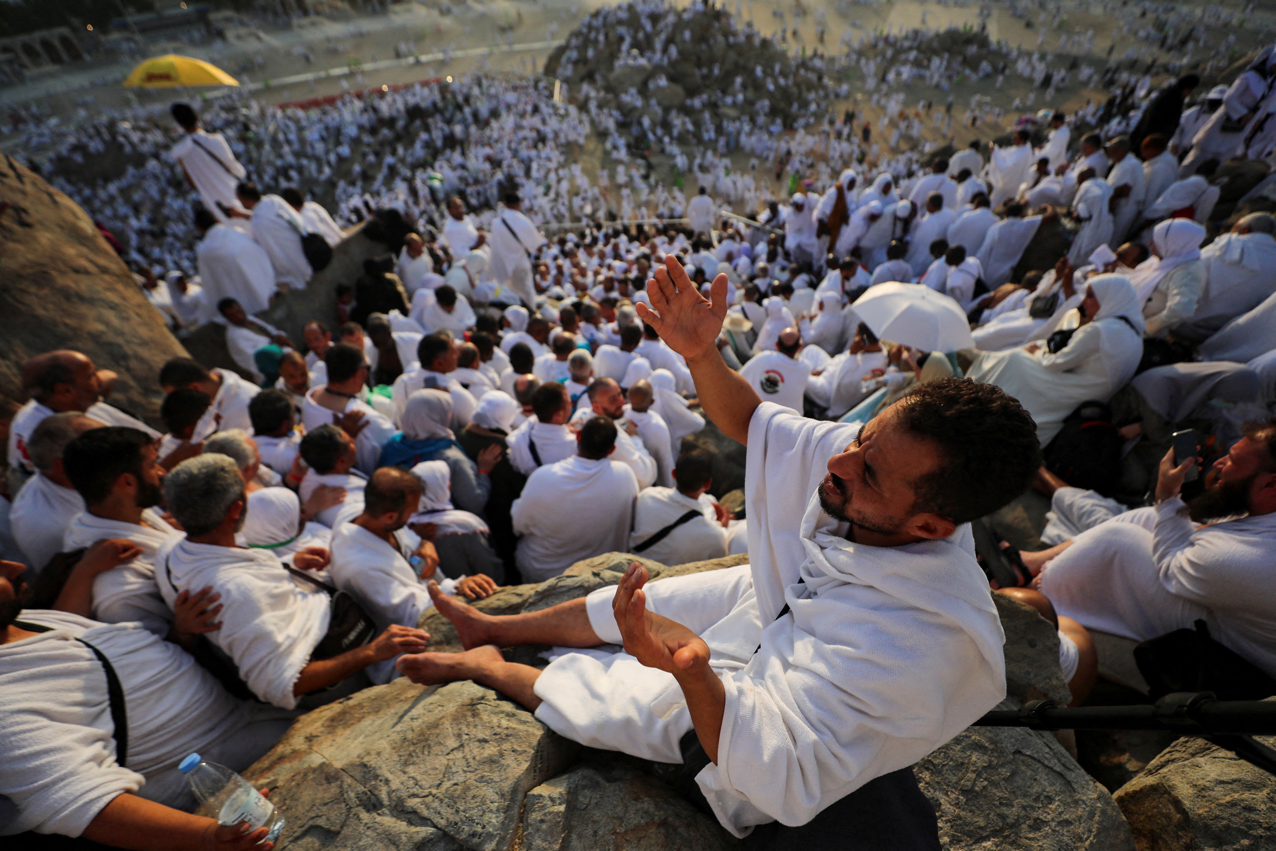 Muslim pilgrims pray on the Mount of Mercy at the plain of Arafat