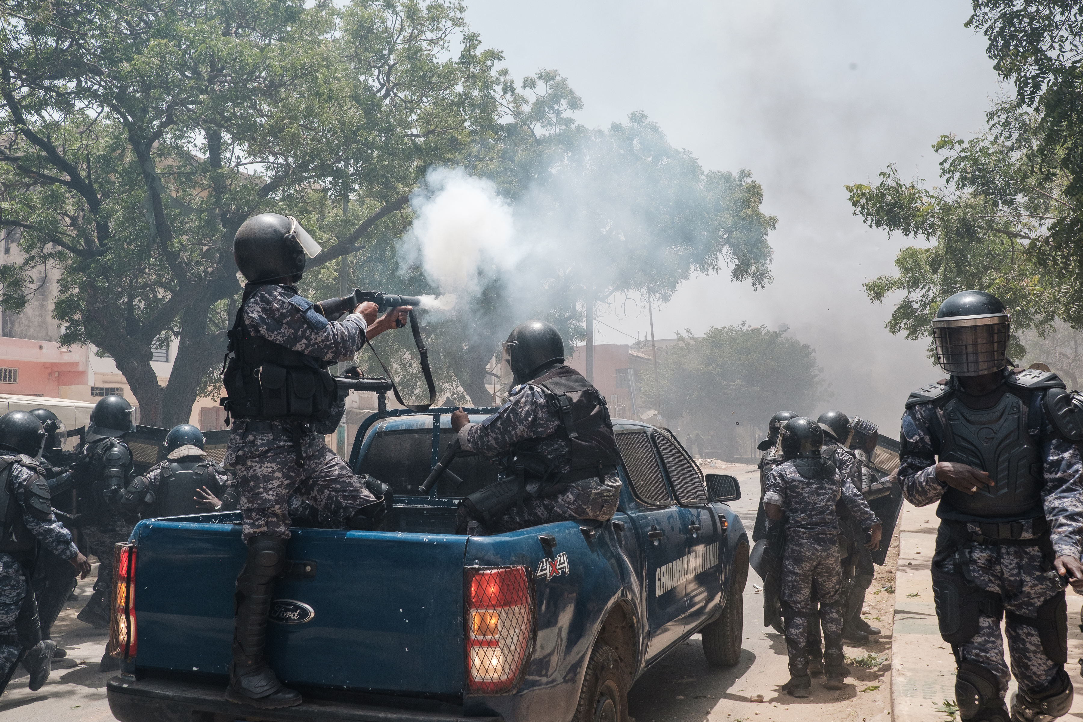 Police fire tear gas at supporters of opposition leader, Ousmane Sonko in Dakar on June 1, 2023, during unrest following his sentencing to two years in prison. - A court in Senegal on Thursday sentenced opposition leader Ousmane Sonko, a candidate in the 2024 presidential election, to two years in prison on charges of "corrupting youth" but acquitted him of rape and issuing death threats. (Photo by GUY PETERSON / AFP)