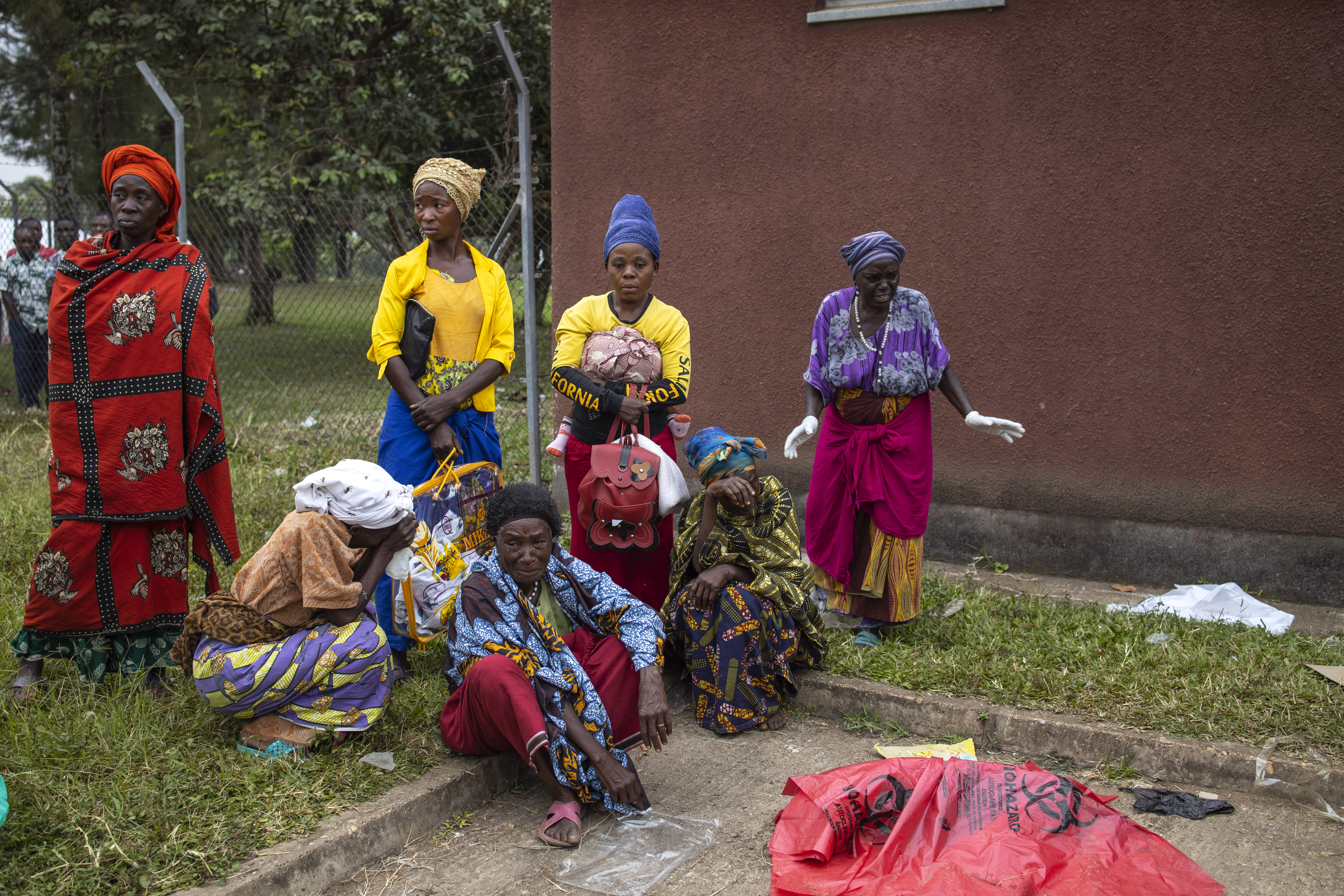 Relatives of victims of the Mpondwe Lhubiriha Secondary School gather at the Bwera General Hospital Mortuary