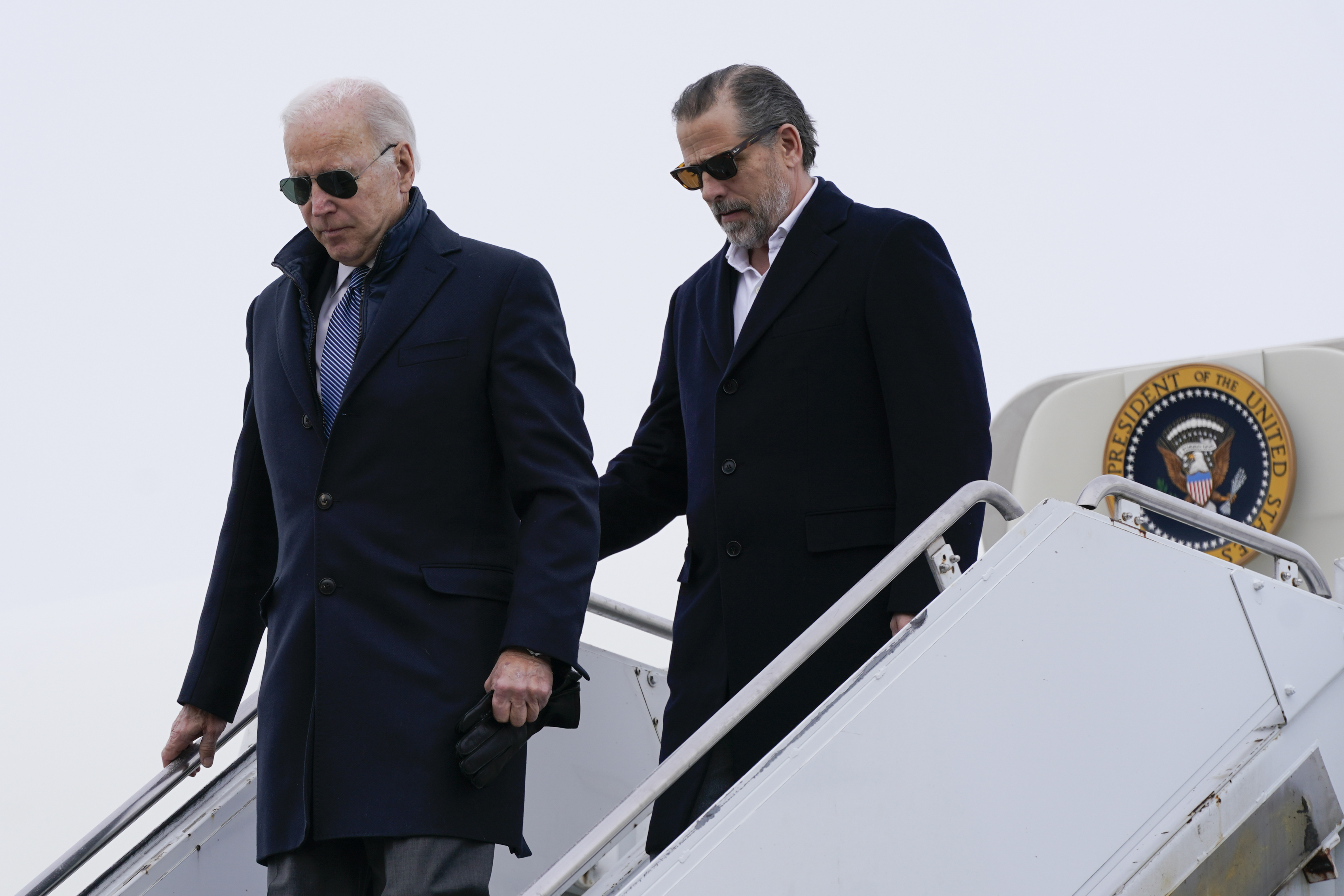 US President Joe Biden and his son Hunter Biden step off Air Force One