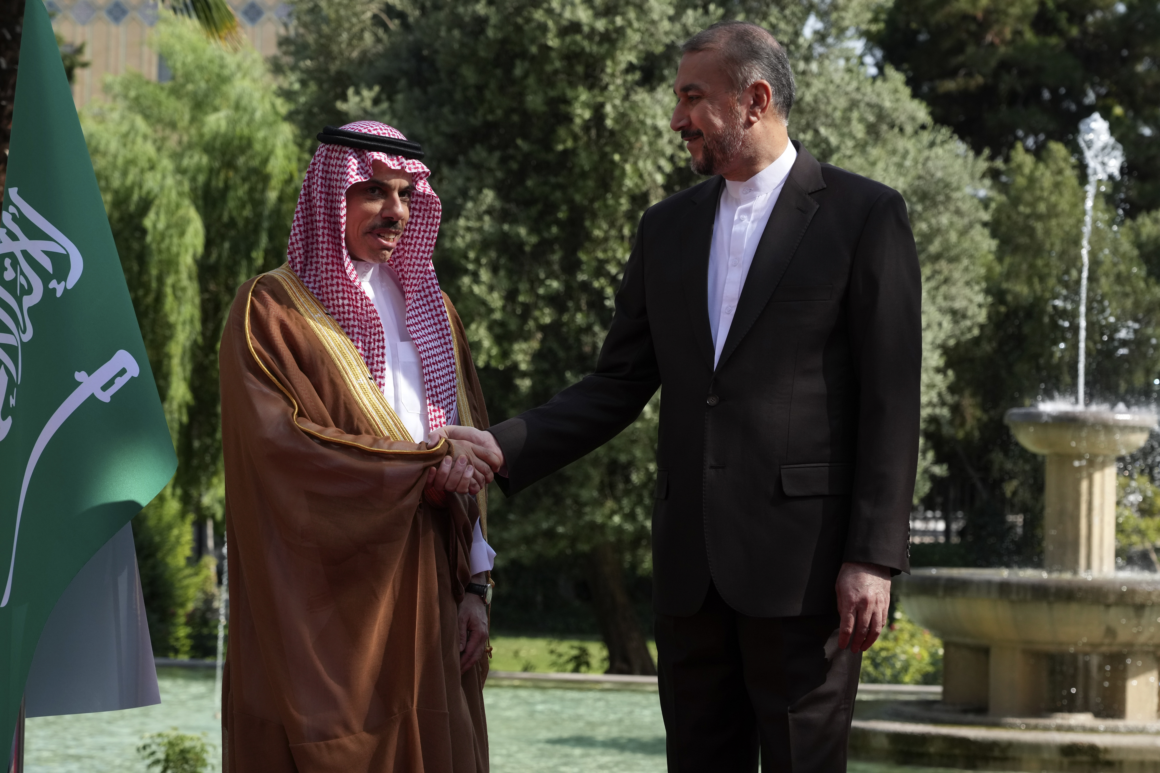 Iranian Foreign Minister Hossein Amirabdollahian, right, and his Saudi counterpart Prince Faisal bin Farhan