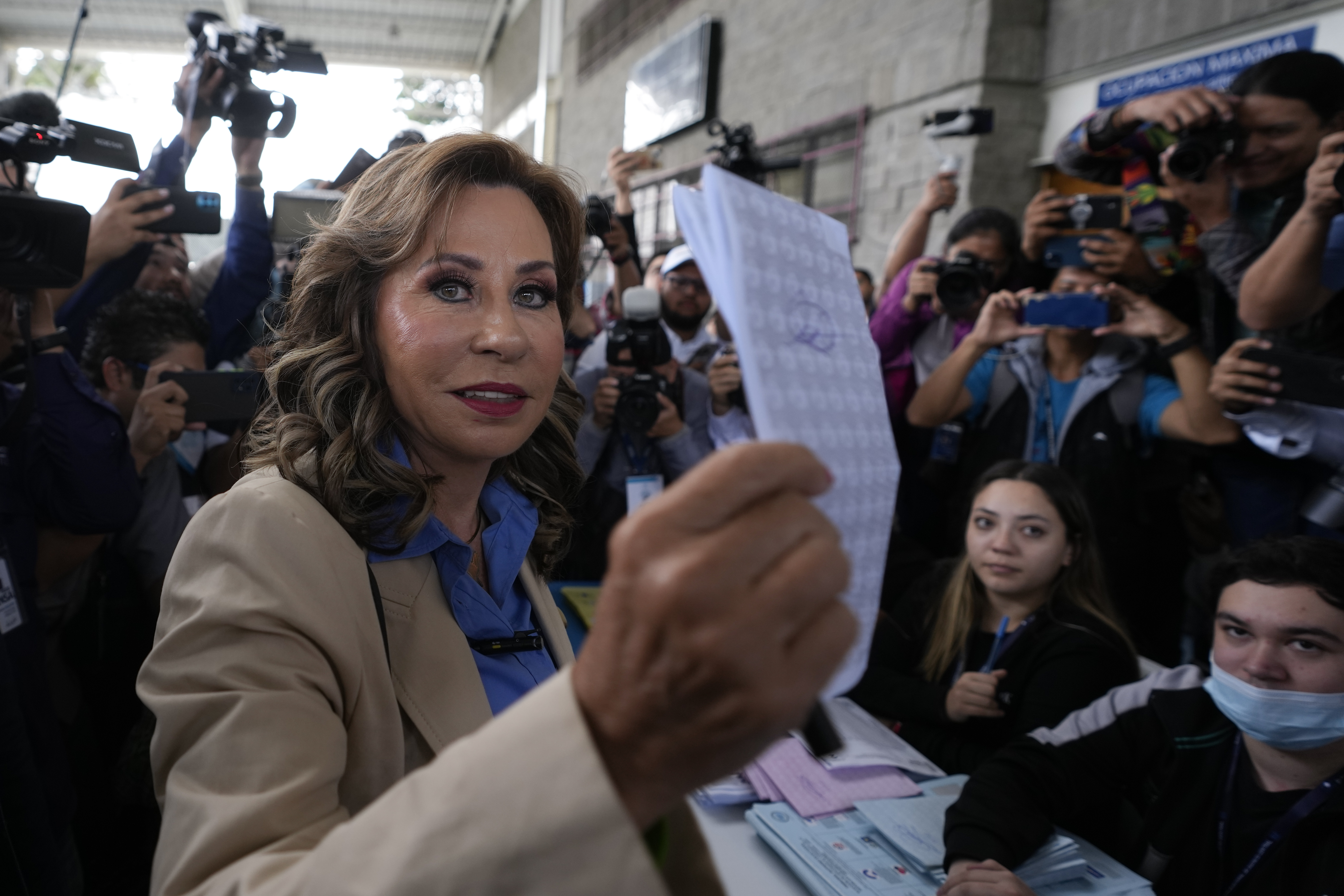 Guatemalan presidential candidate Sandra Torres holds up her ballot