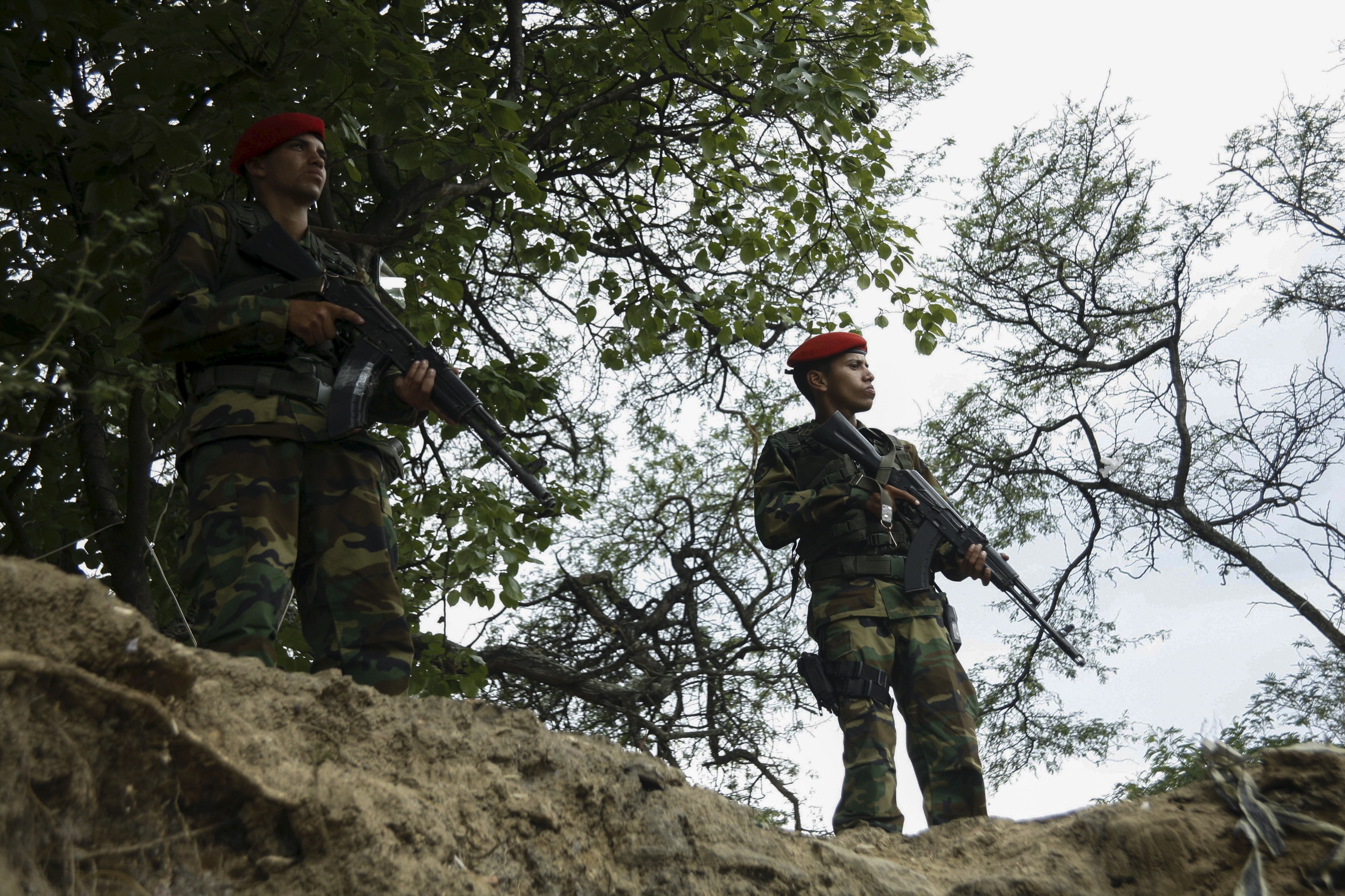 Venezuelan soldiers patrol close to the border with Colombia, as part of a special deployment, at San Antonio in Tachira state, Venezuela, August 23, 2015.
