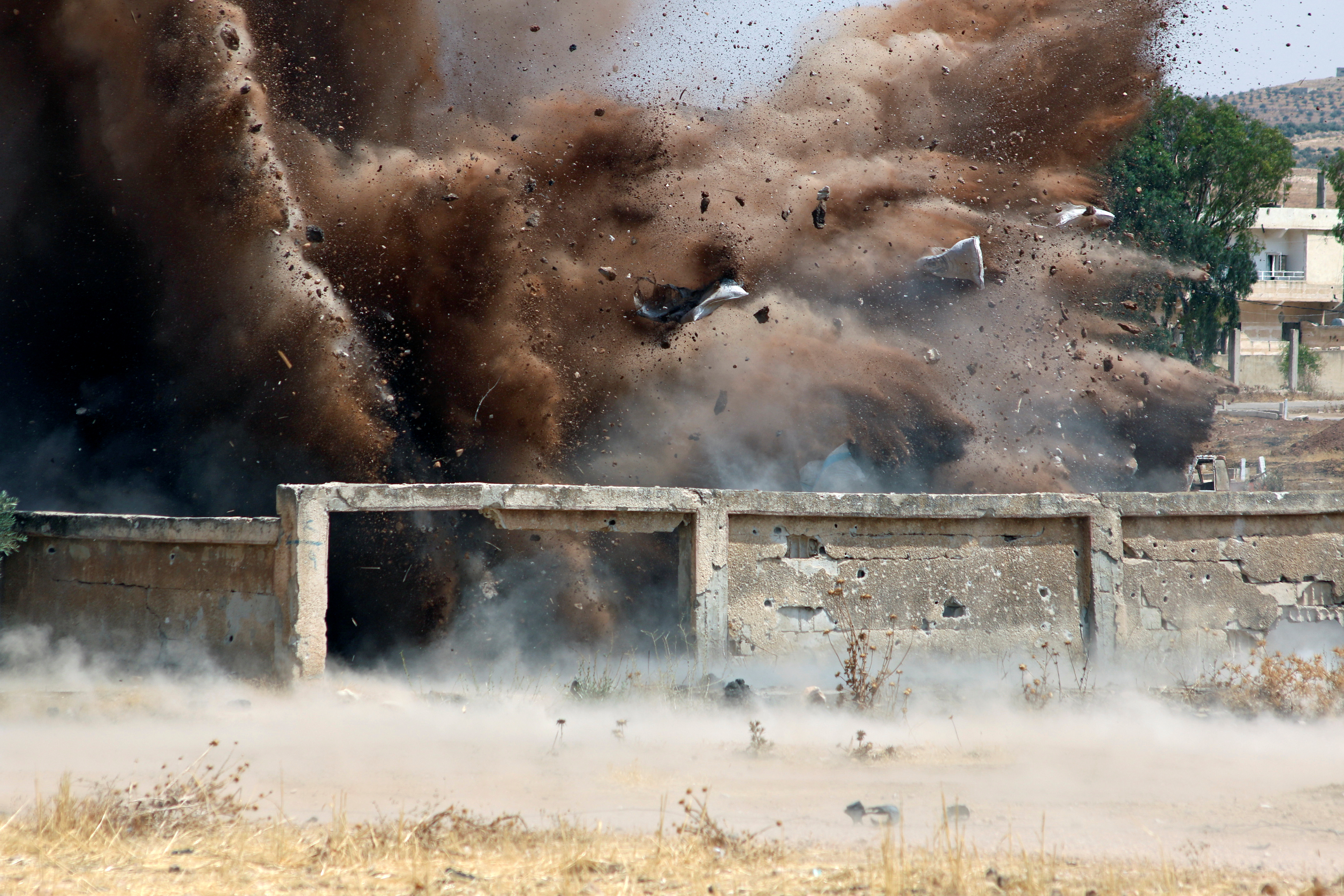 Civil defense members safely detonate cluster bombs