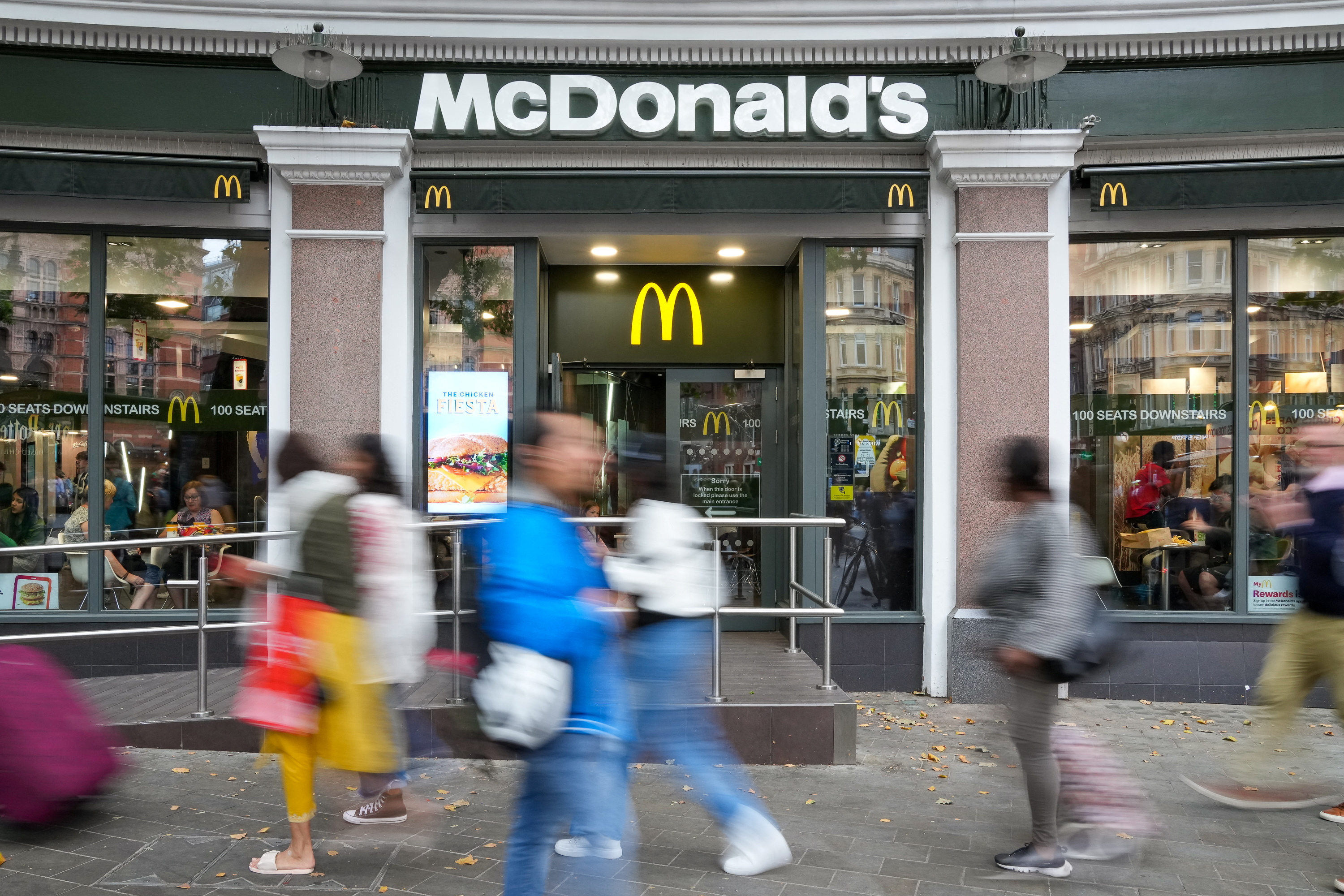 People walk past McDonald's store in London, Britain