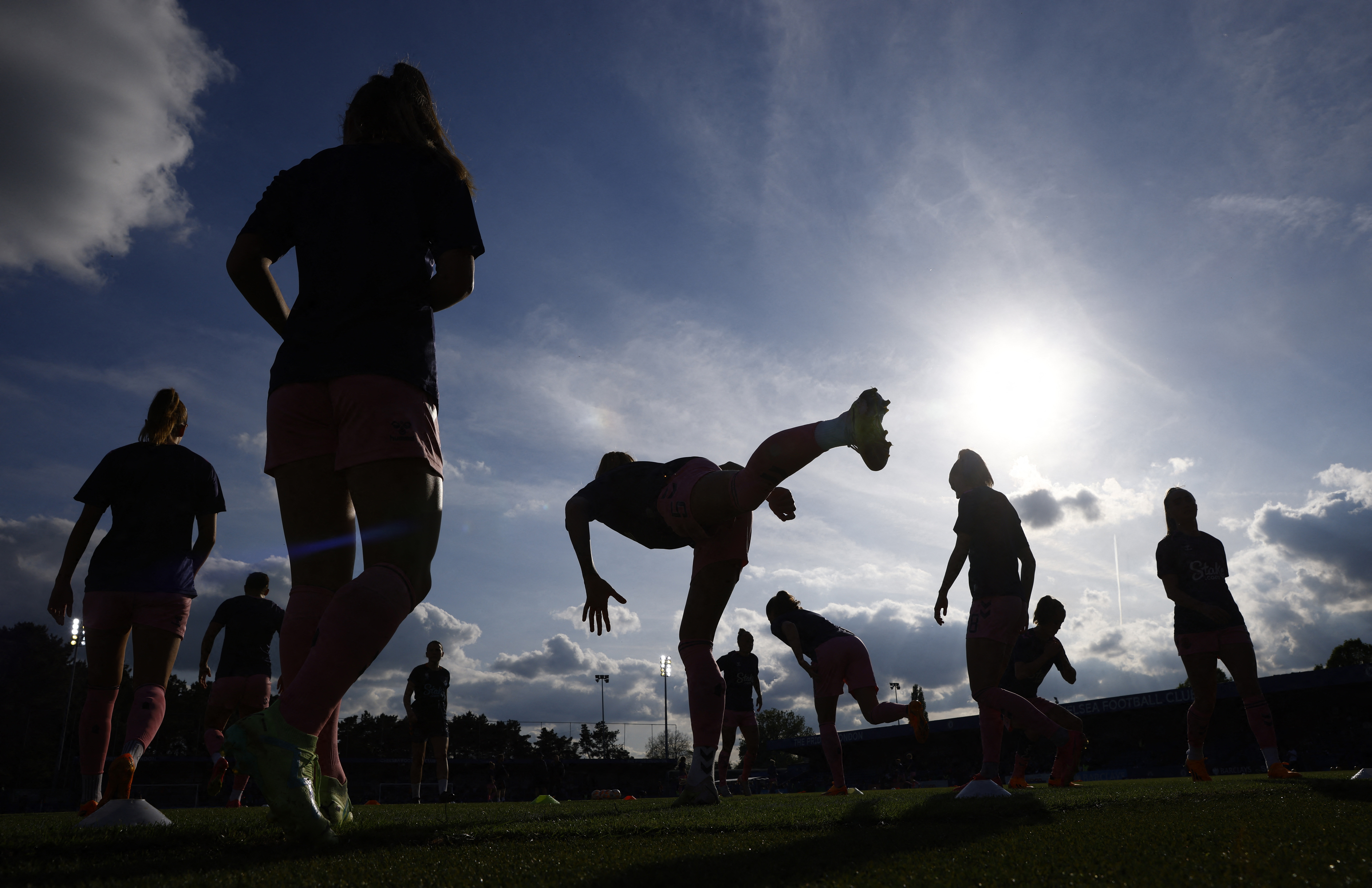 Everton players warm up before a match