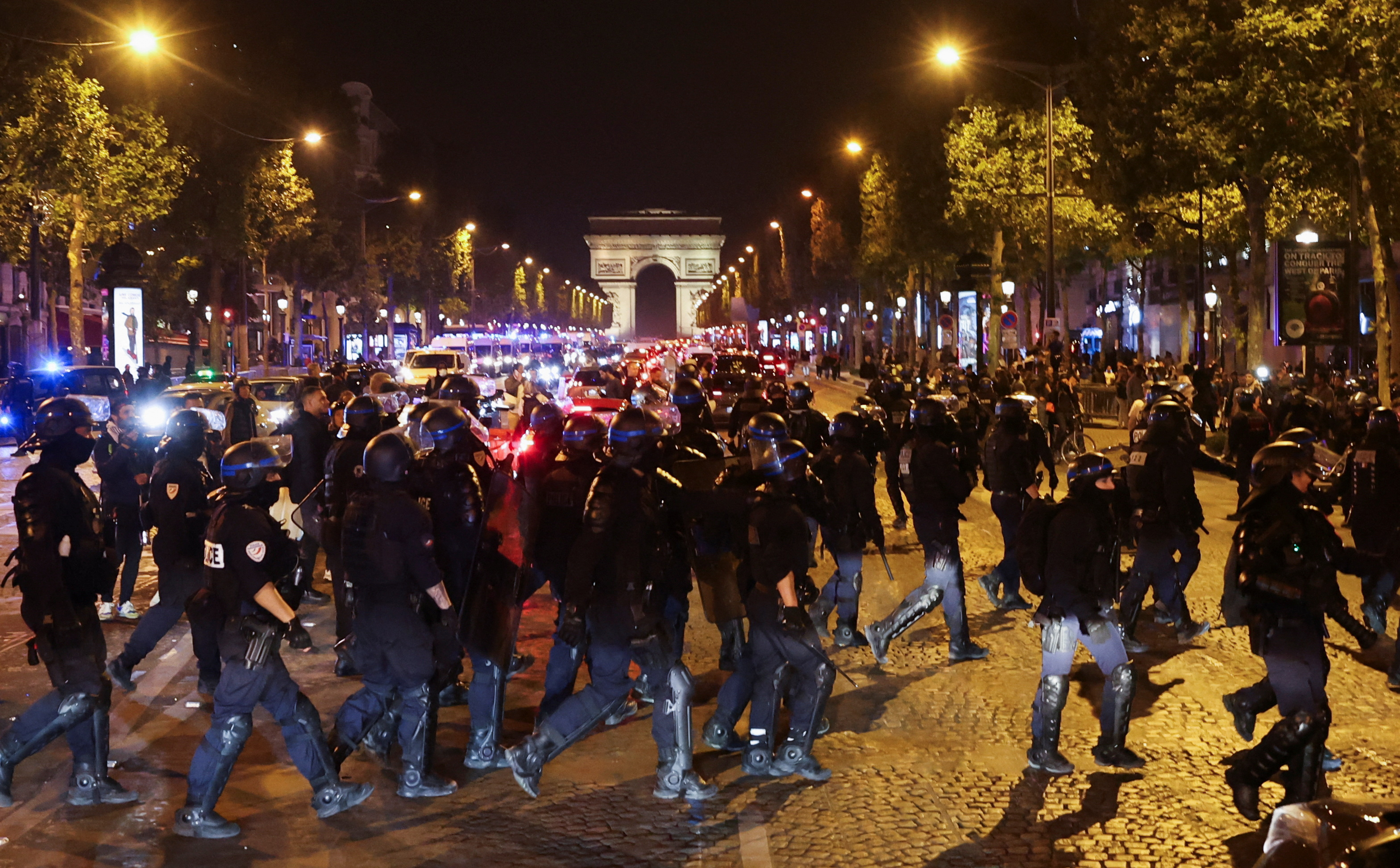 Police officers take position during riots following the death of Nahel, a 17-year-old teenager killed by a French police officer in Nanterre during a traffic stop