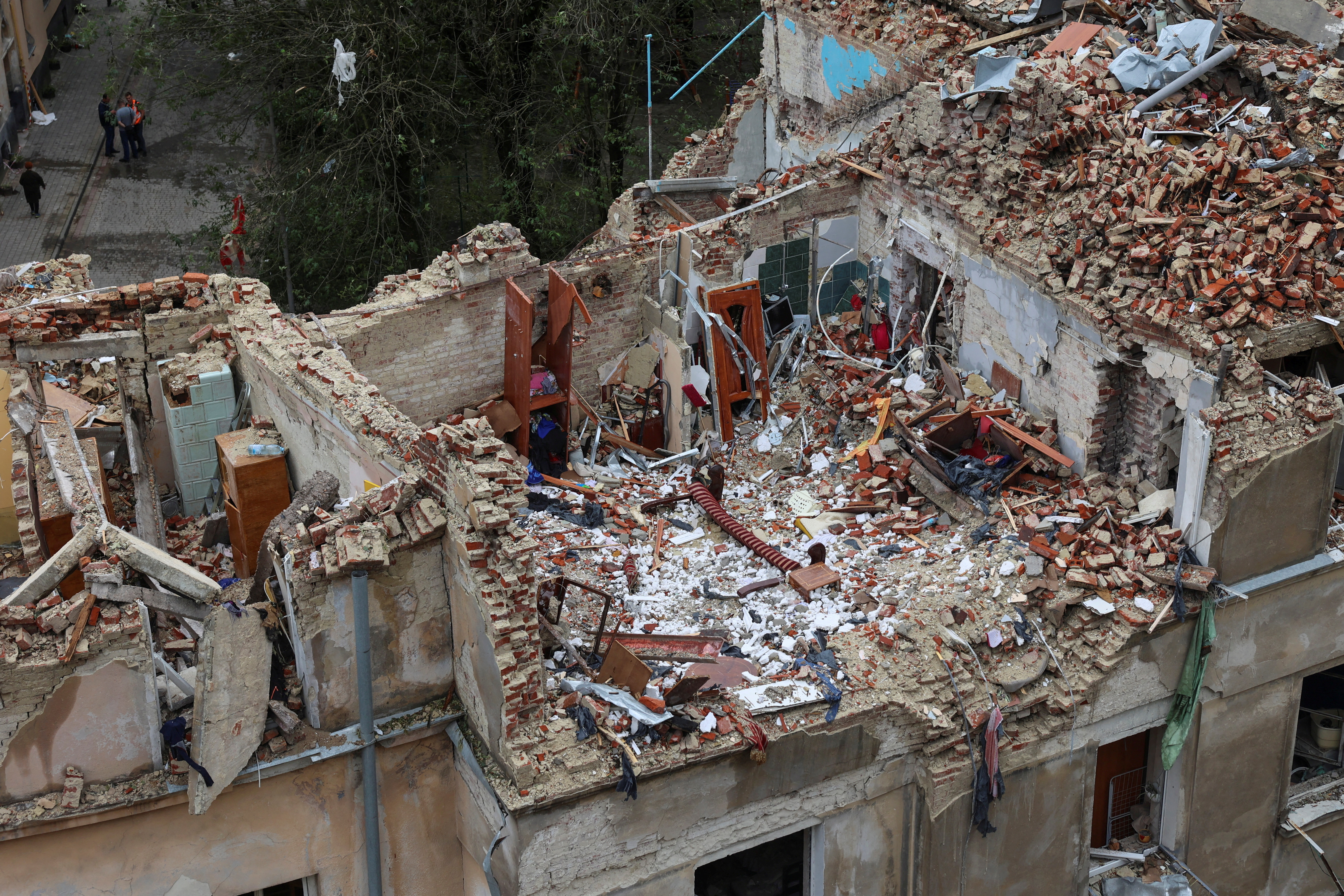 This image shows a residential building damaged by a Russian missile strike in the city of Lviv