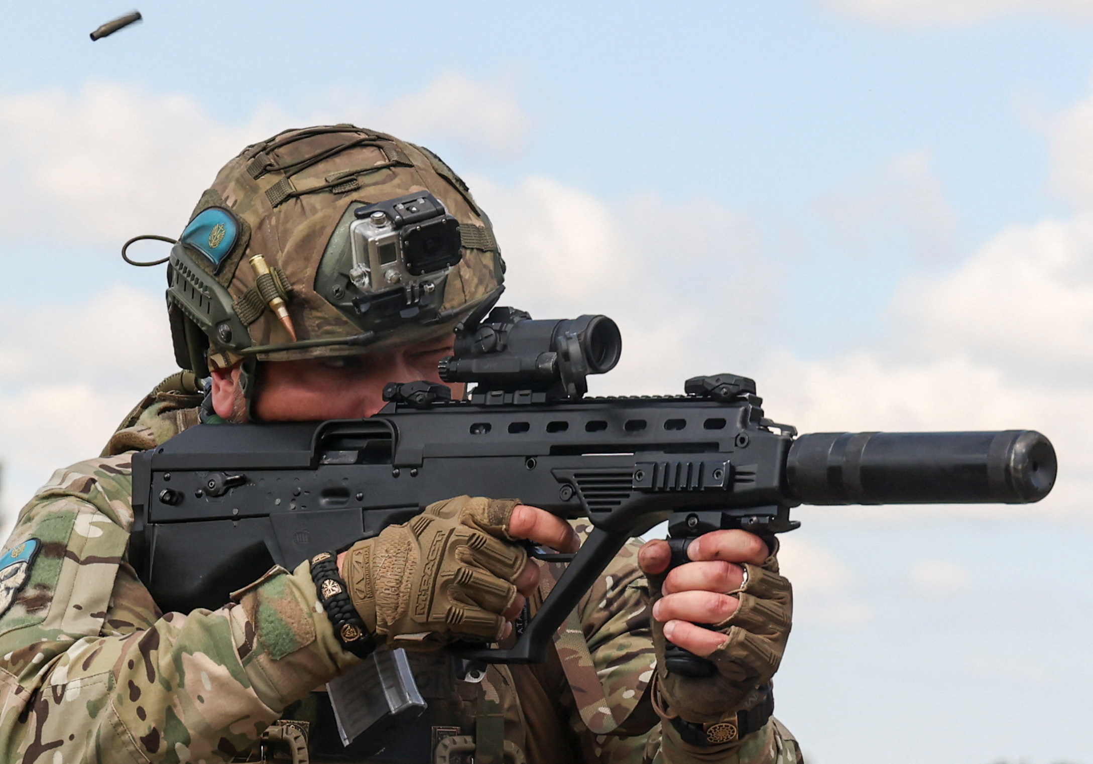 A Ukrainian serviceman of the 35th Separate Marines Brigade fires an assault rifle at a training ground, amid Russia's attack on Ukraine, in Donetsk region, Ukraine July 24, 2023.