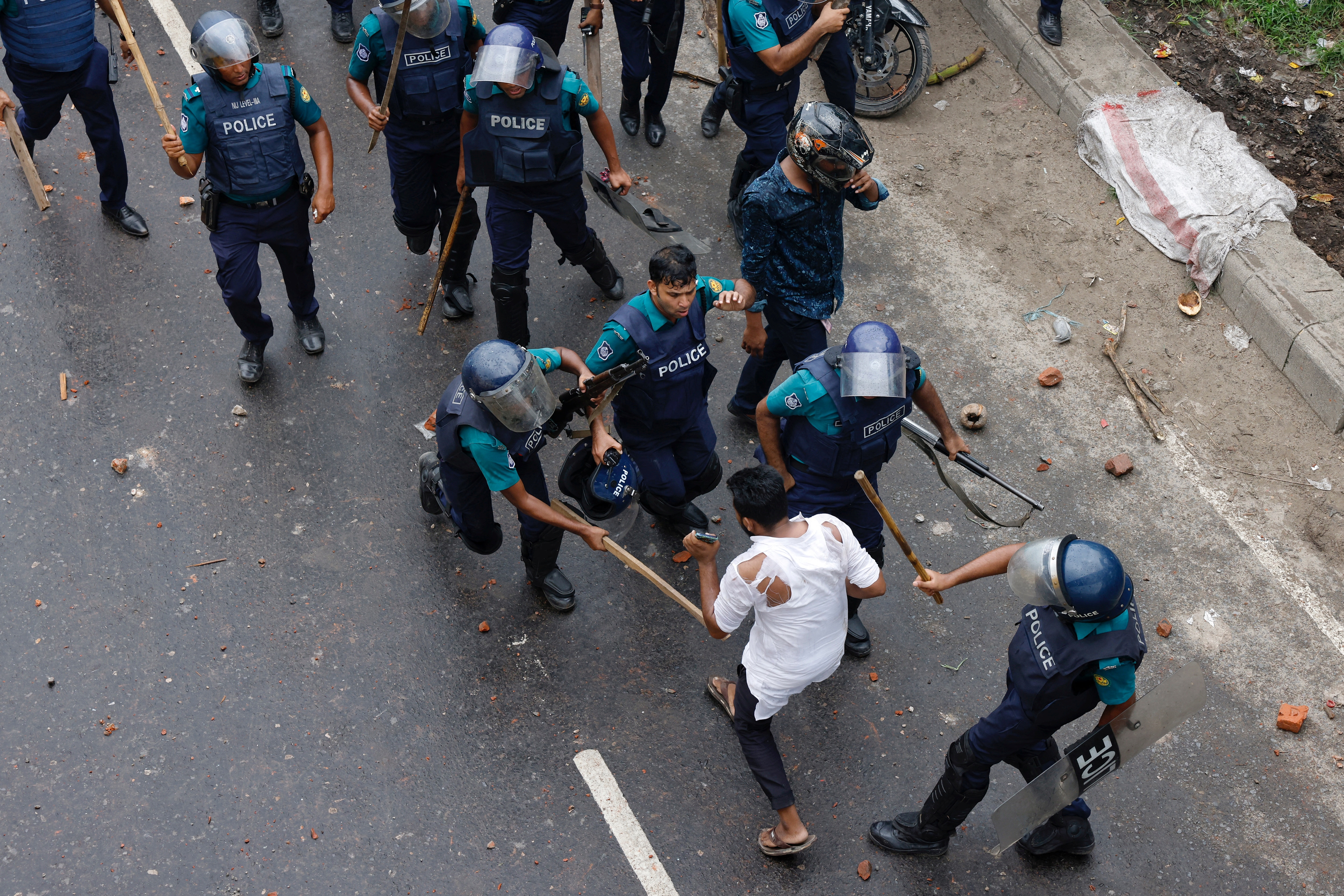 Police charge baton on a man during sit-in rallies of Bangladesh Nationalist Party (BNP)