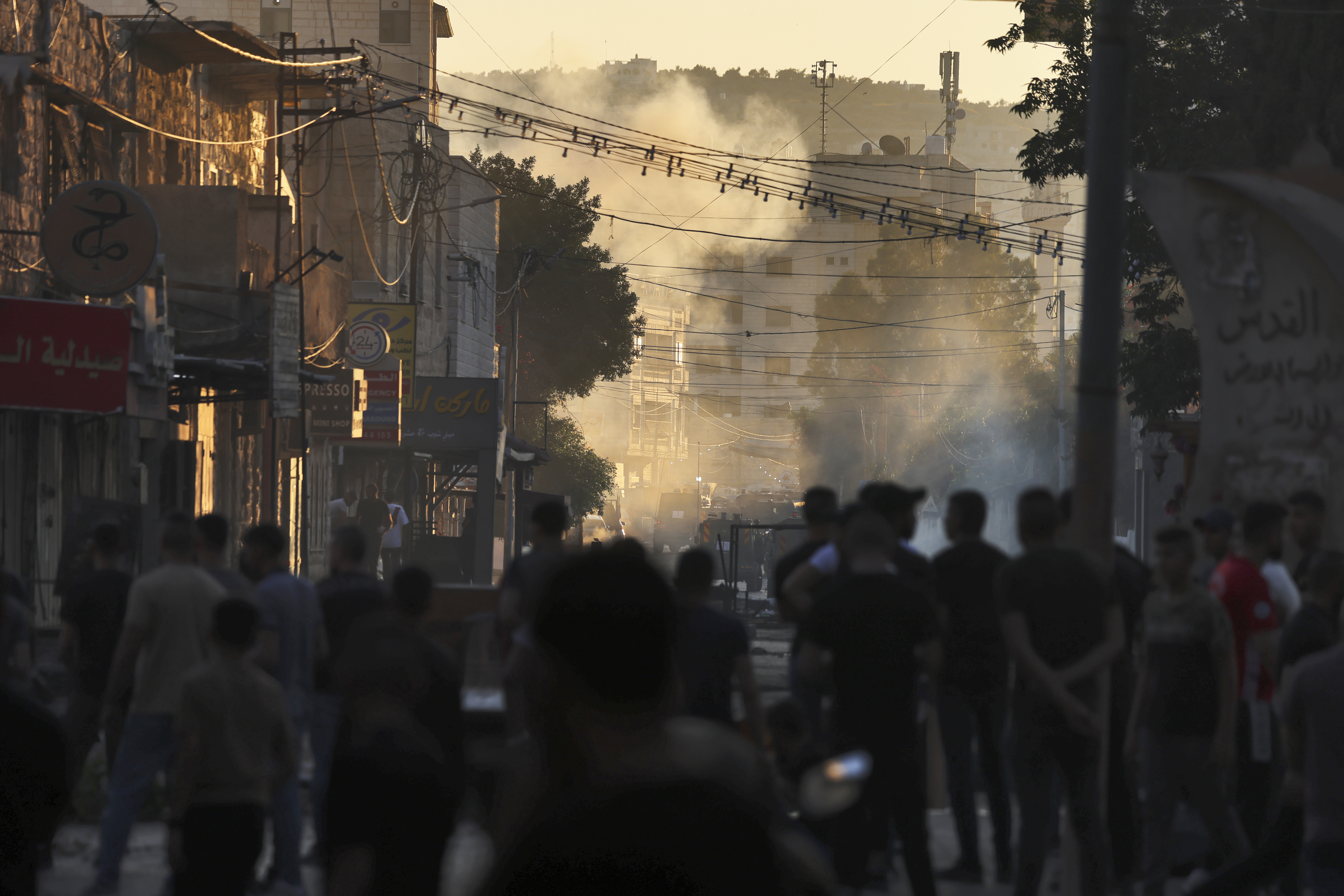 Palestinians protest against Israeli forces during a military operation in the Jenin refugee camp