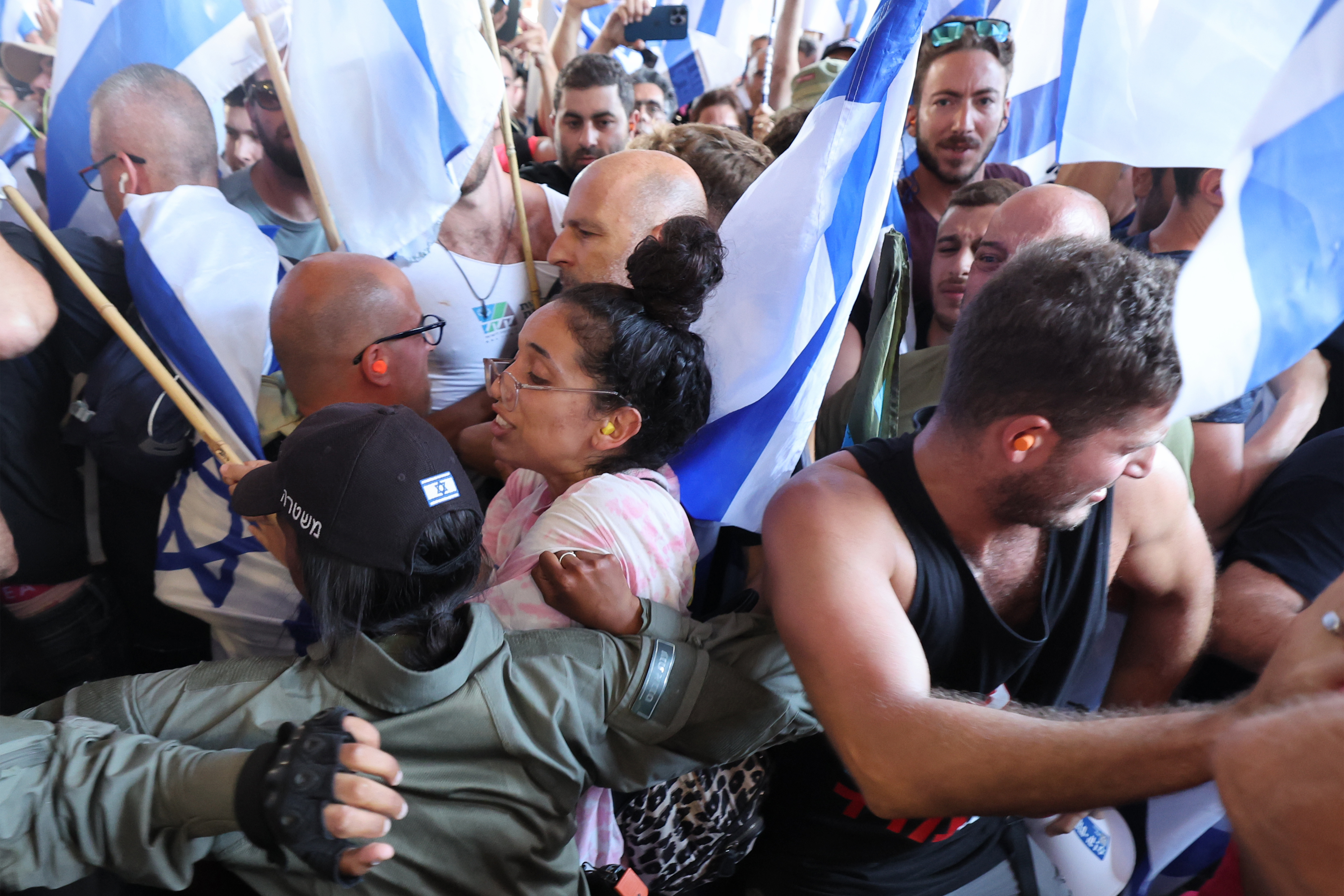 Demonstrators shove with Israeli border guards