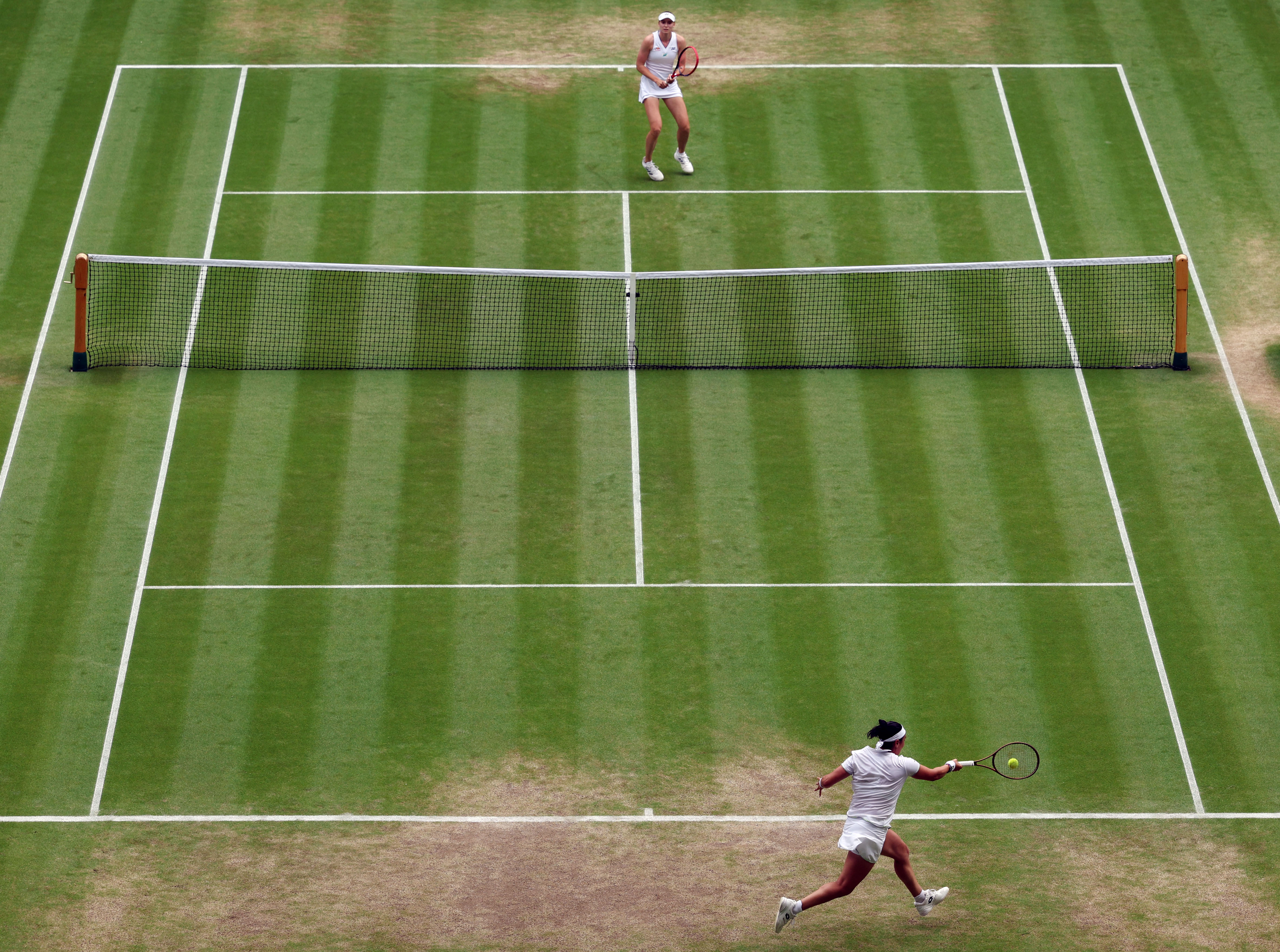 Tunisia's Ons Jabeur returns the ball to Kazakhstan's Elena Rybakina during their women's singles quarter-finals tennis match 