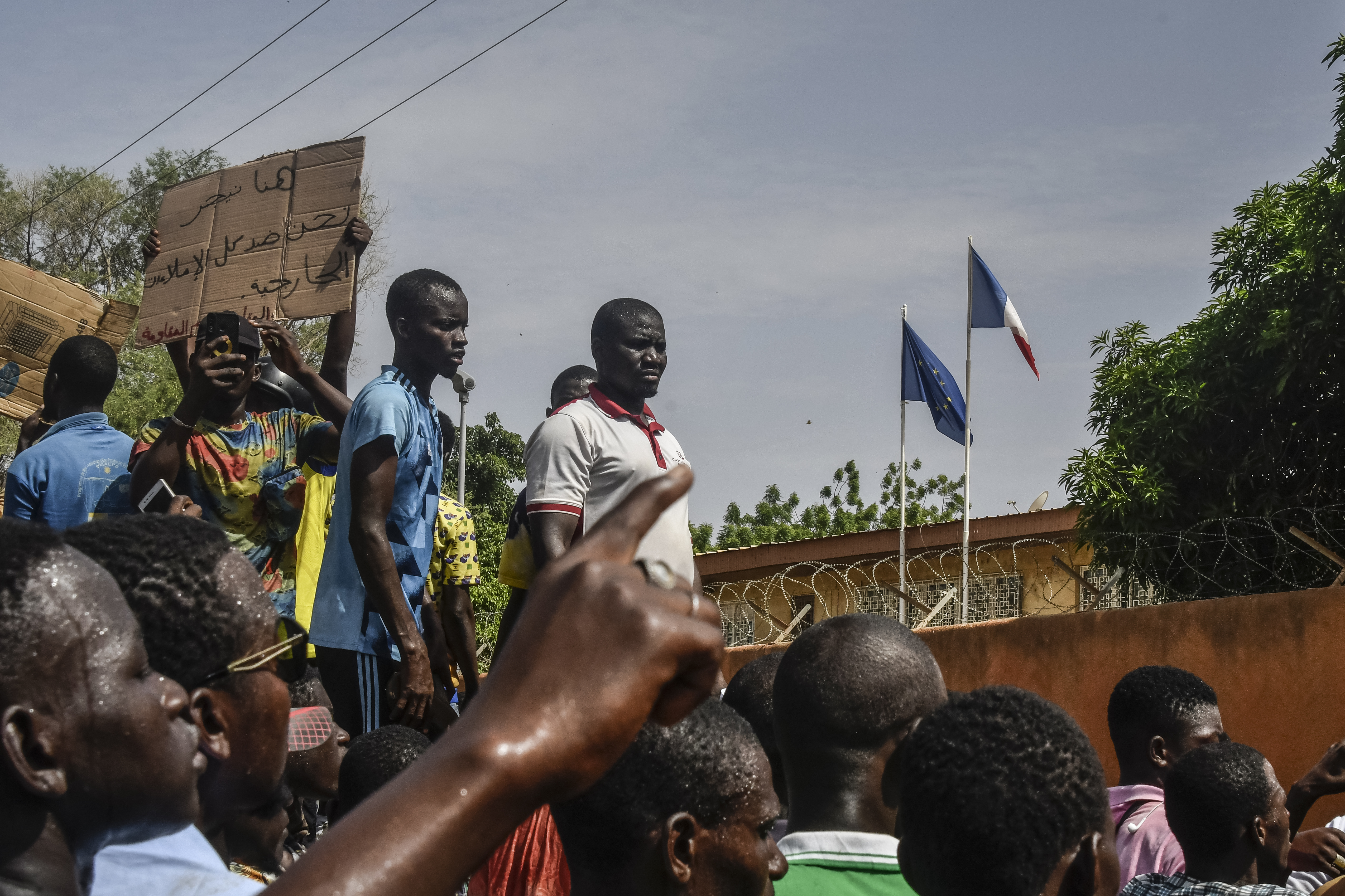Protesters gather in front of the French Embassy in Niamey