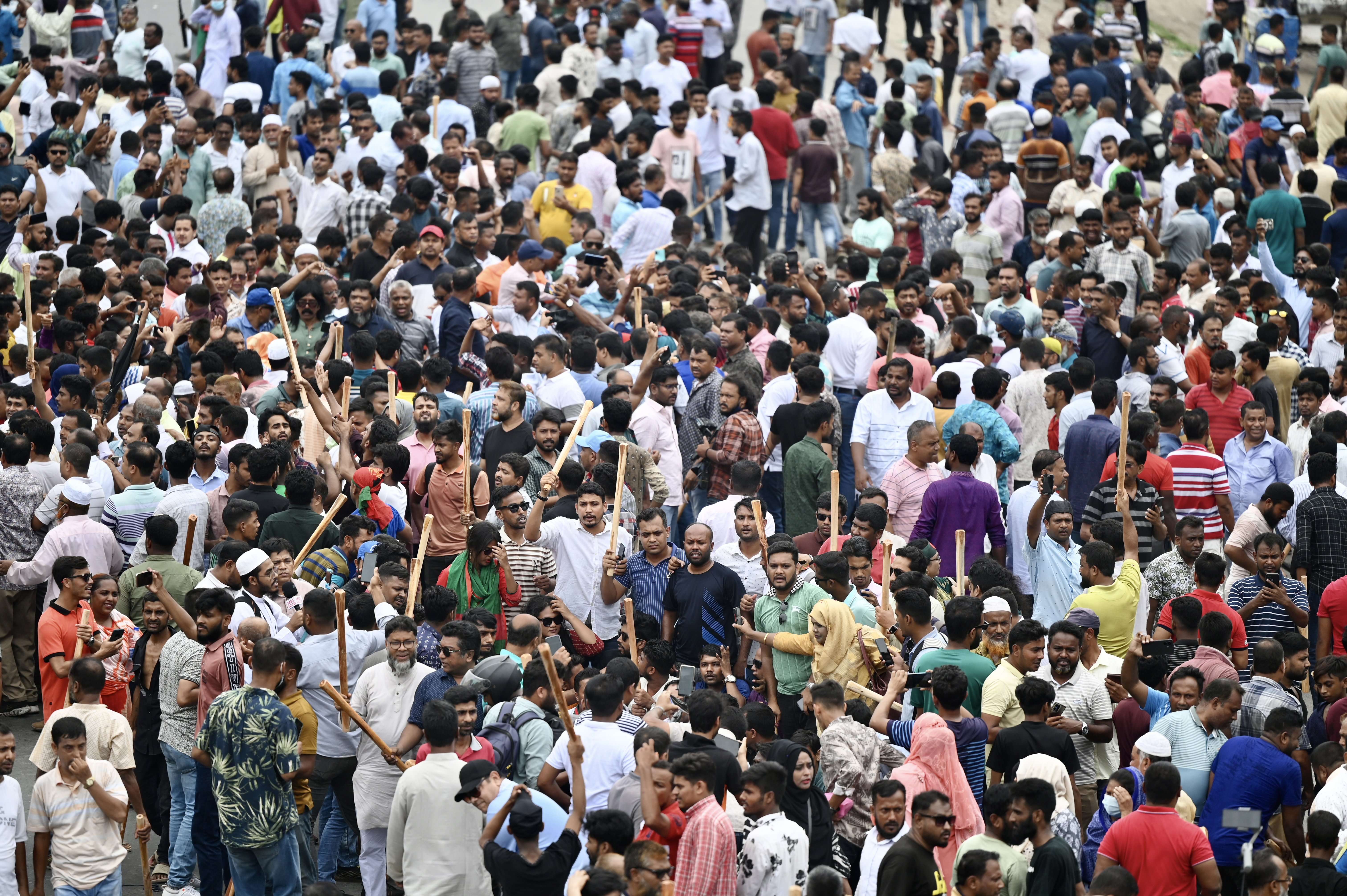 Bangladesh Nationalist party (BNP) activists block a highway entering Bangladesh's capital during a protest demanding the resignation of Prime Minister Sheikh Hasina and a general election under a neutral caretaker government, in Dhaka on July 29, 2023. 