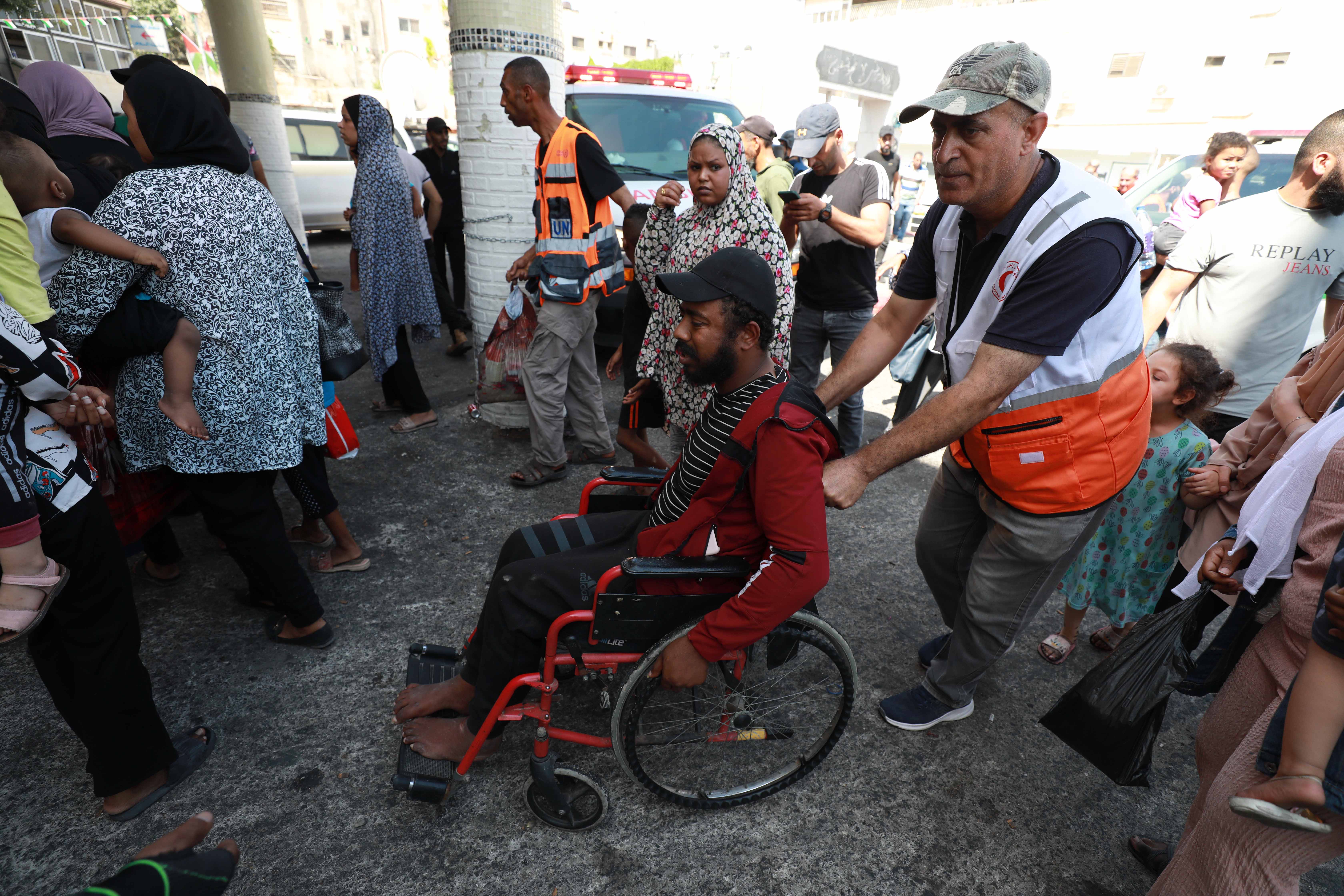 A relative of Thaer Abu Johar and Odai Alaqmeh arrives at Jenin's public hospital 