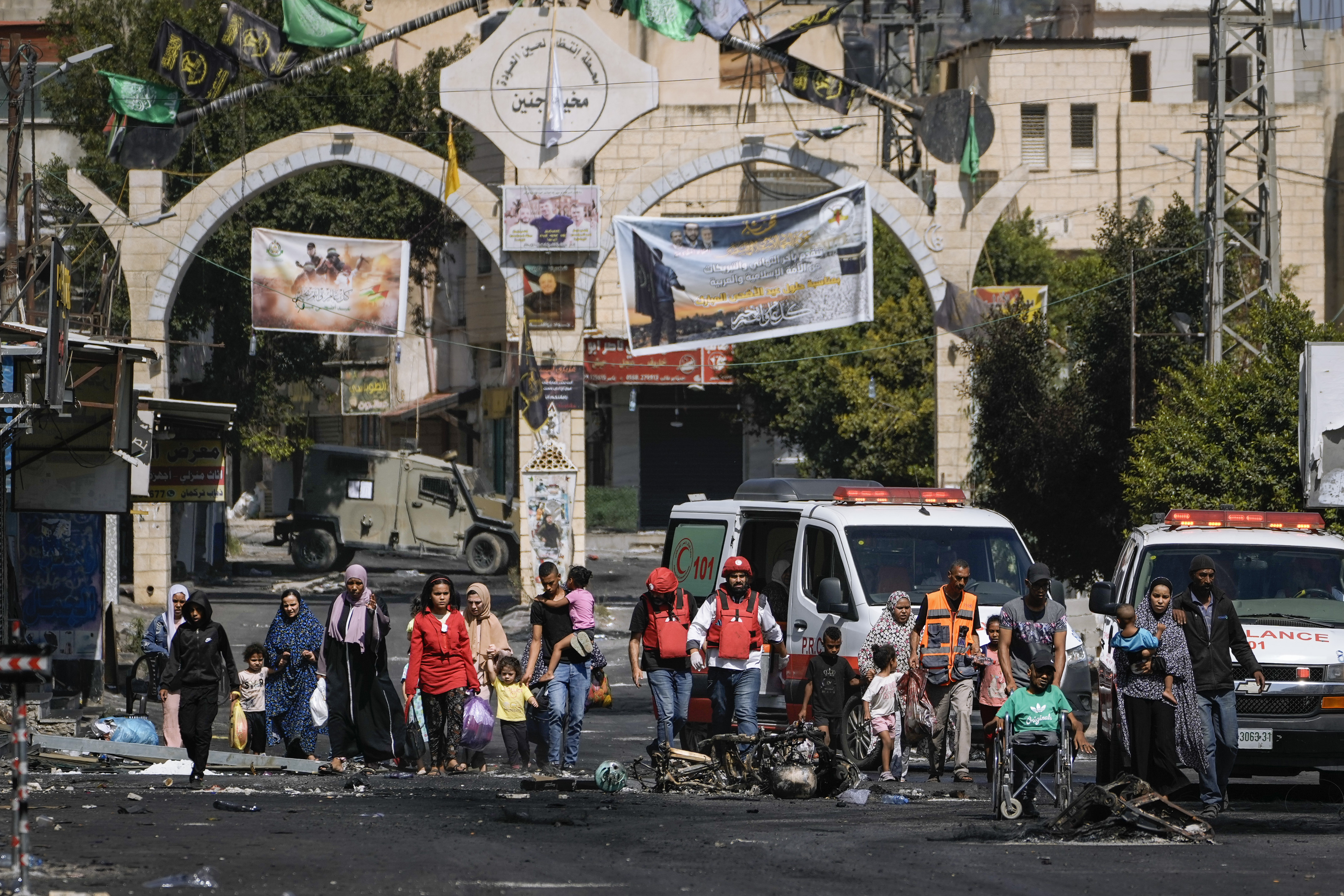 Residents of the Jenin refugee camp fled their homes as the Israeli military pressed ahead with an operation in the area, in Jenin, West Bank, Tuesday, July 4, 2023. Palestinian health officials put the Palestinian death toll from the two-day raid at 10. The Israeli military said Israel launched the operation because some 50 attacks over the past year had emanated from Jenin. (AP Photo/Majdi Mohammed)