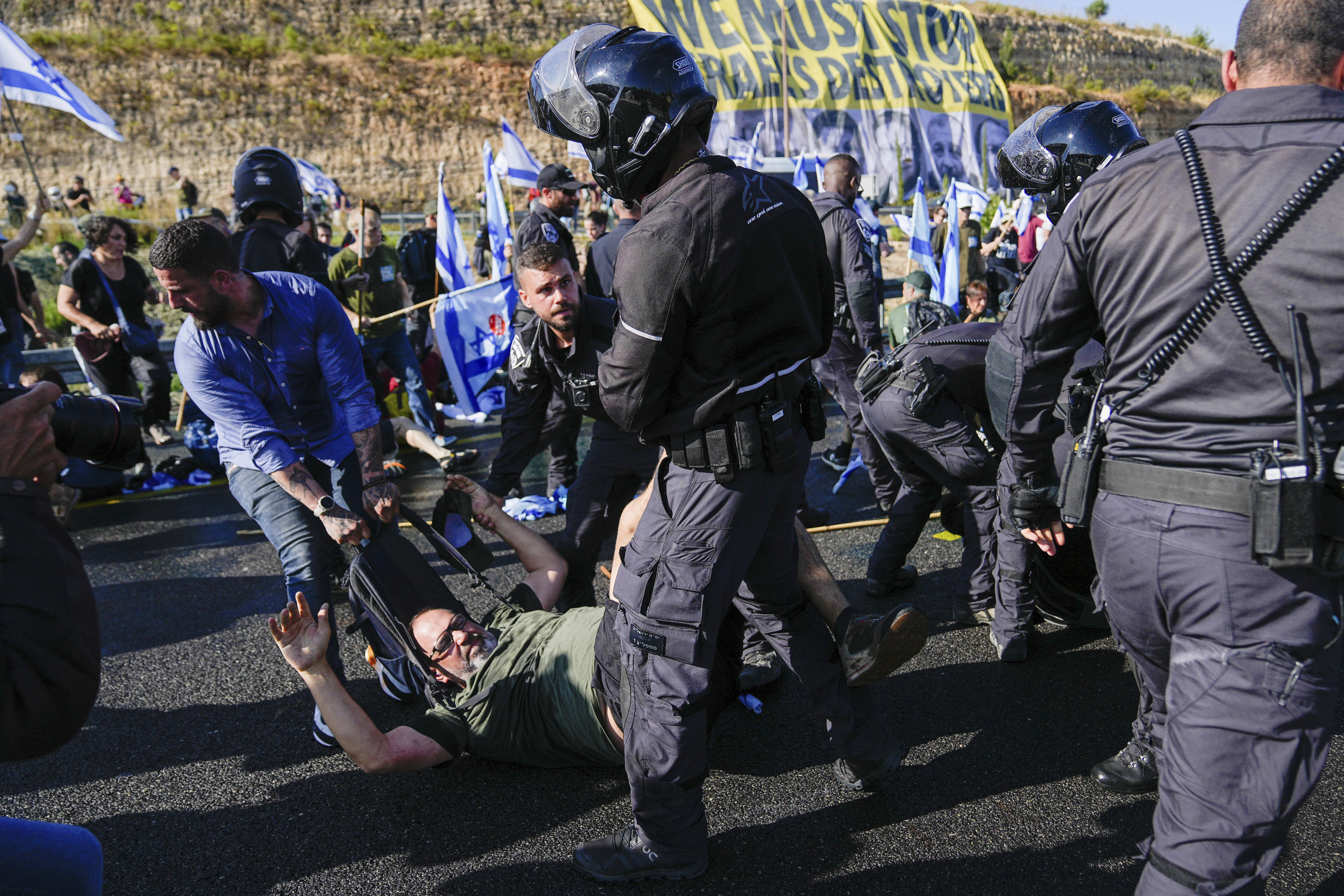 Israeli police officers disperse demonstrators