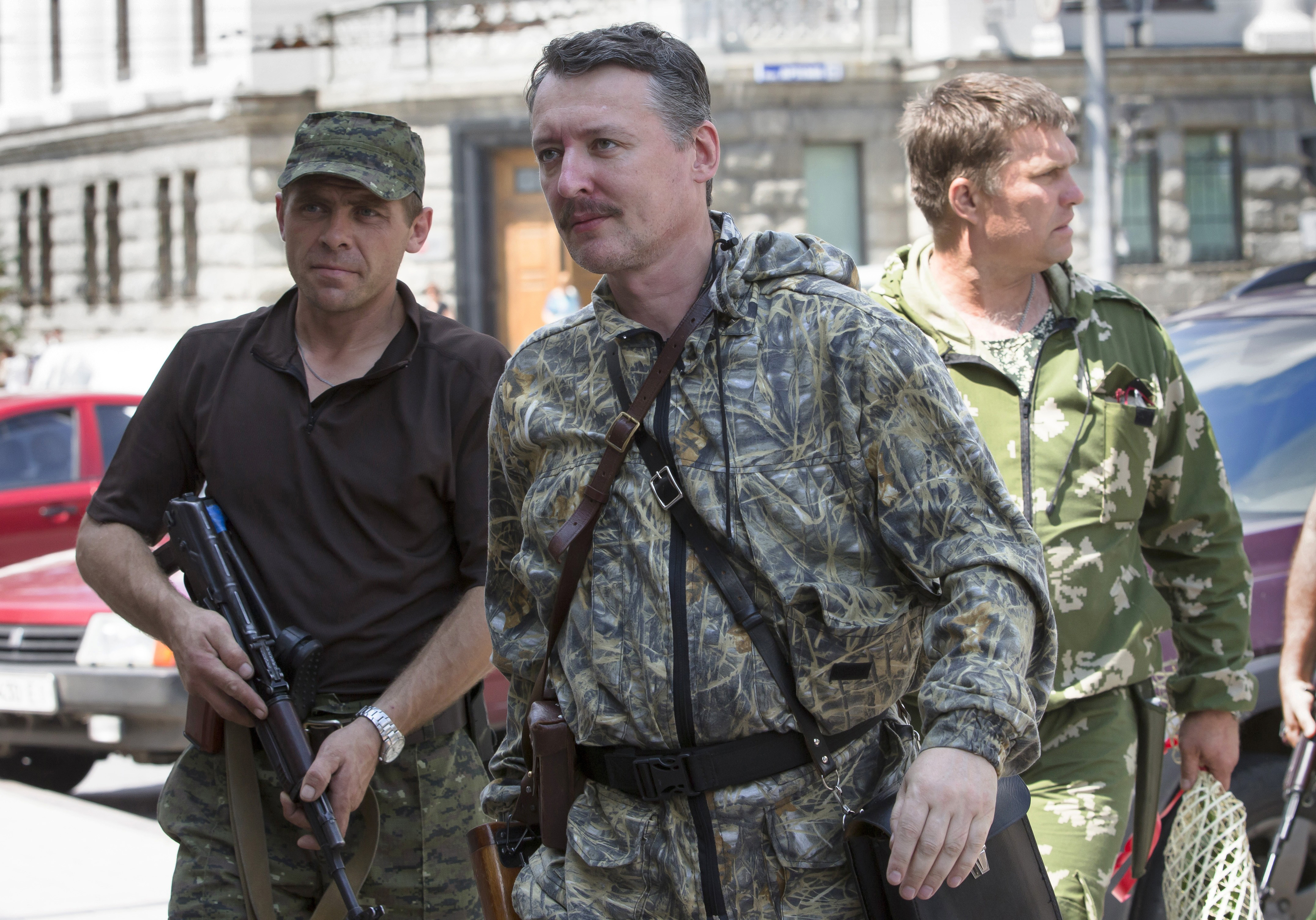 Igor Girkin also known as Igor Strelkov, a pro-Russian commander, center, arrives for the wedding of platoon commander Arsen Pavlov and Elena Kolenkina in the city of Donetsk