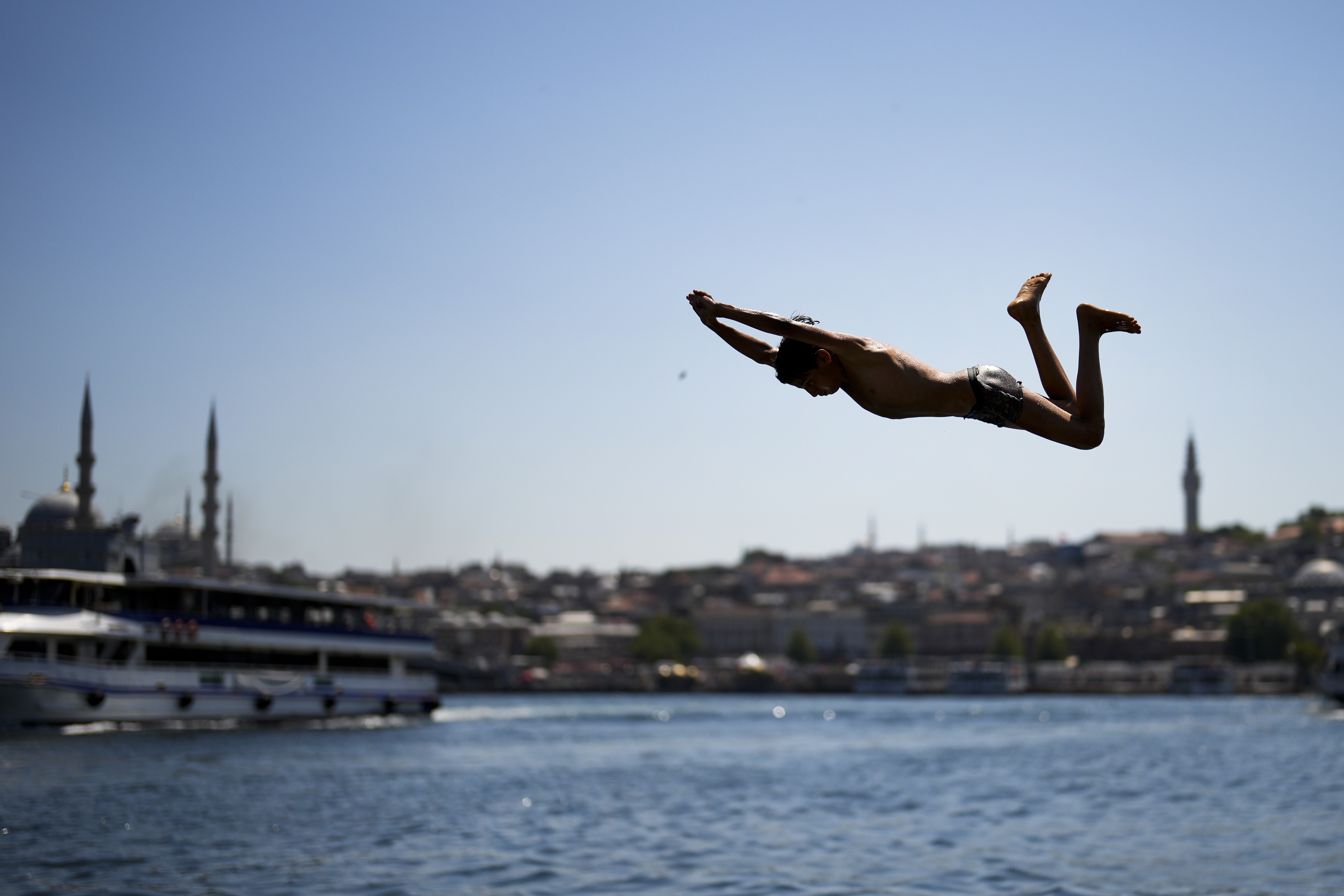 A youngster dives into the Bosphorus