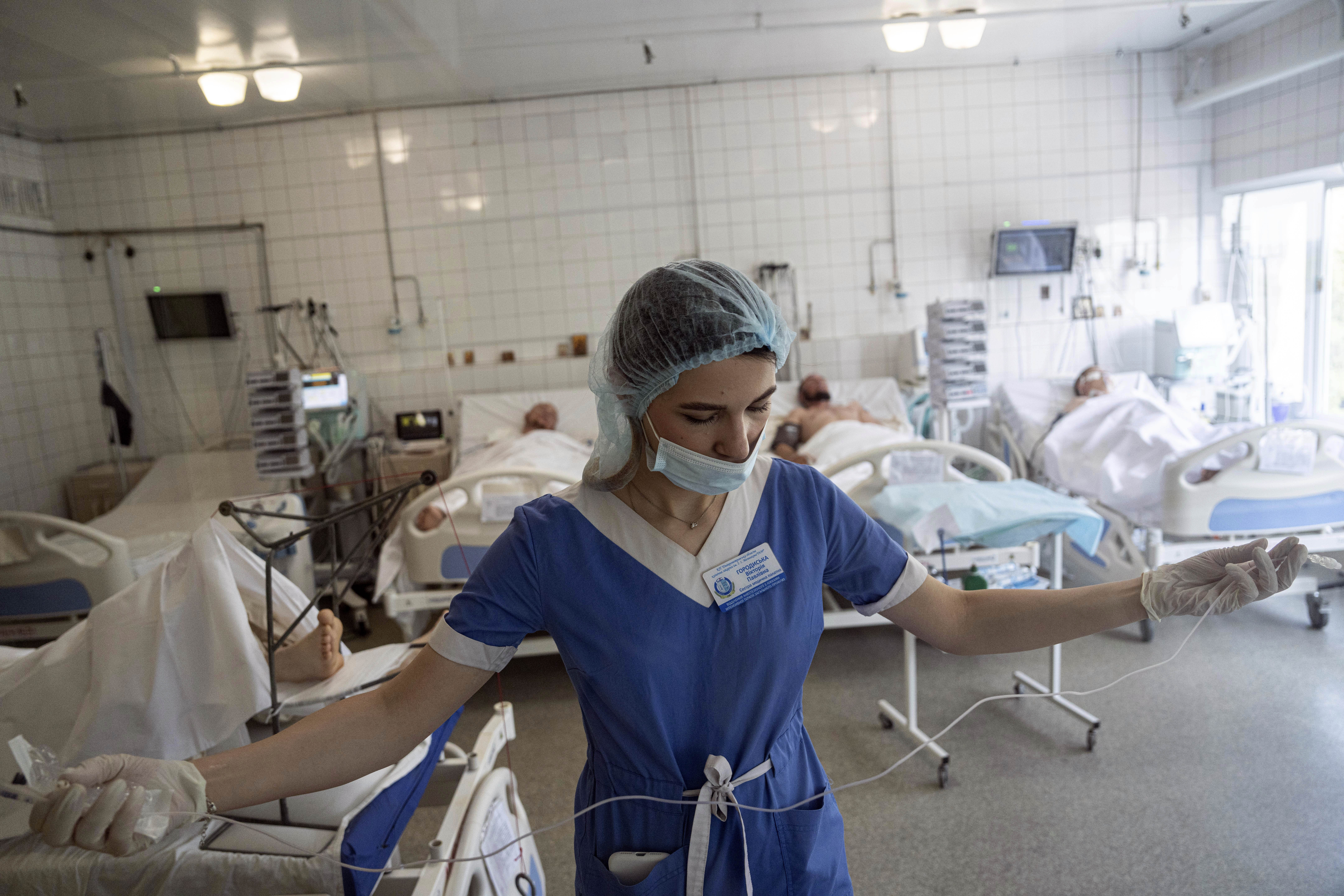 A nurse prepares to treat Ukrainian servicemen at the ICU
