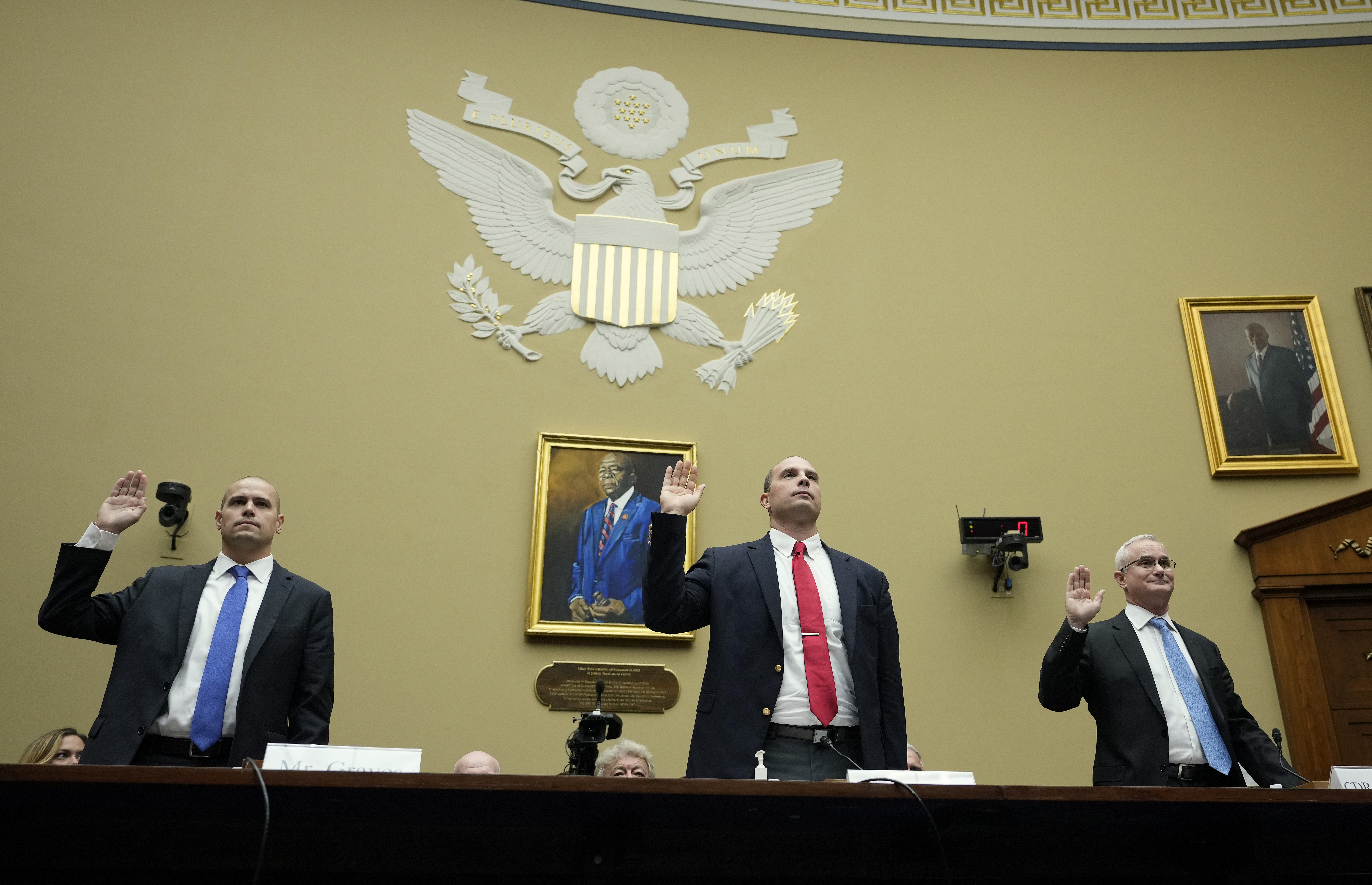 WASHINGTON, DC - JULY 26: Ryan Graves, executive director of Americans for Safe Aerospace, David Grusch, former National Reconnaissance Officer Representative of Unidentified Anomalous Phenomena Task Force at the U.S. Department of Defense, and Retired Navy Commander David Fravor are sworn-in during a House Oversight Committee hearing titled Unidentified Anomalous Phenomena: Implications on National Security, Public Safety, and Government Transparency on Capitol Hill 26, 2023 in Washington, DC. Several witnesses are testifying about their experience with possible UFO encounters and discussion about a potential covert government program concerning debris from crashed, non-human origin spacecraft. Drew Angerer/Getty Images/AFP (Photo by Drew Angerer / GETTY IMAGES NORTH AMERICA / Getty Images via AFP)