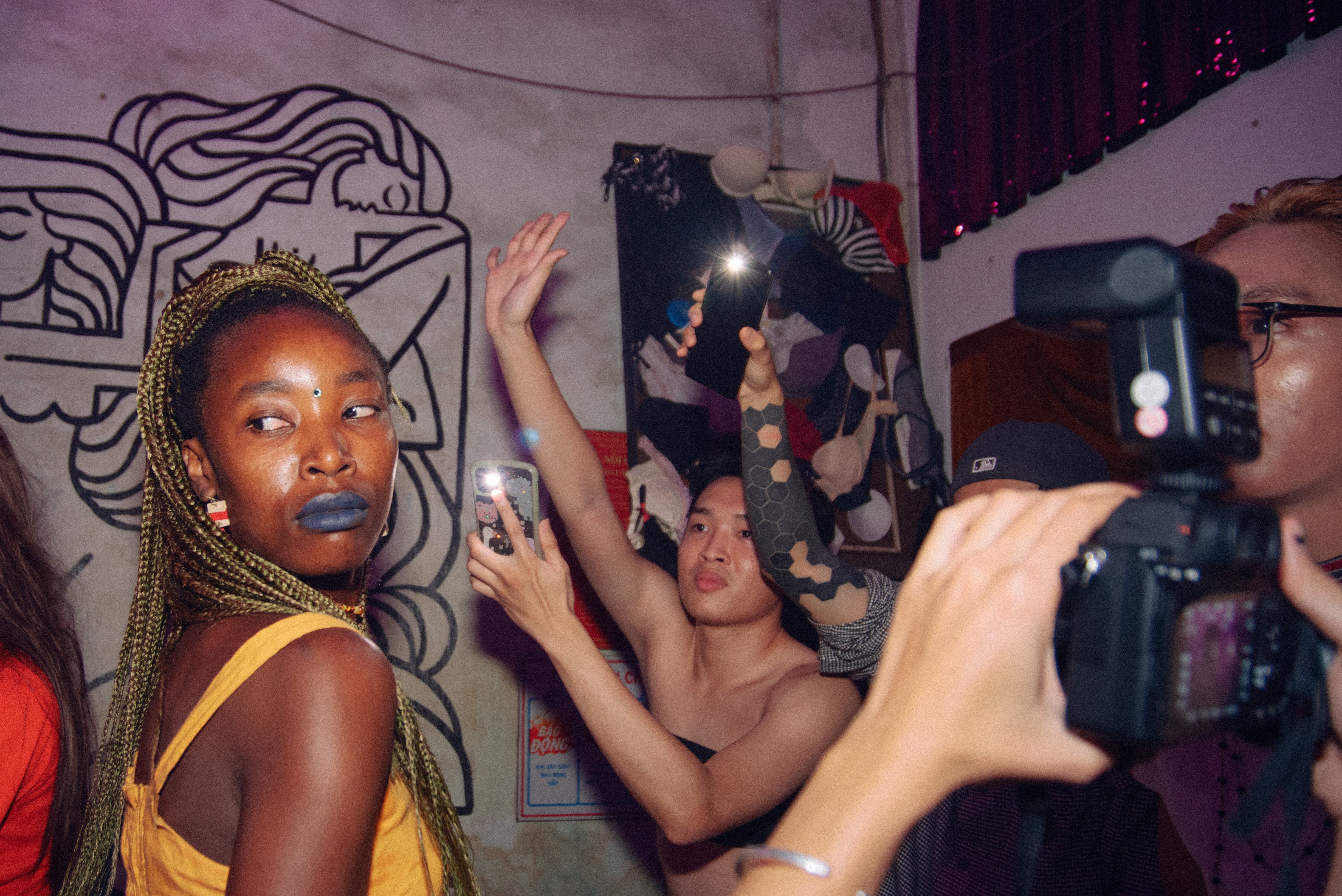 A trans man (second from right) poses with the judges after winning Transmen Realness - a competitive category where trans men give the best impression of straight, cisgender men at Nguyen Hue Kiki Ball in Ho Chi Minh City [Courtesy of Ngo Tien Dat]