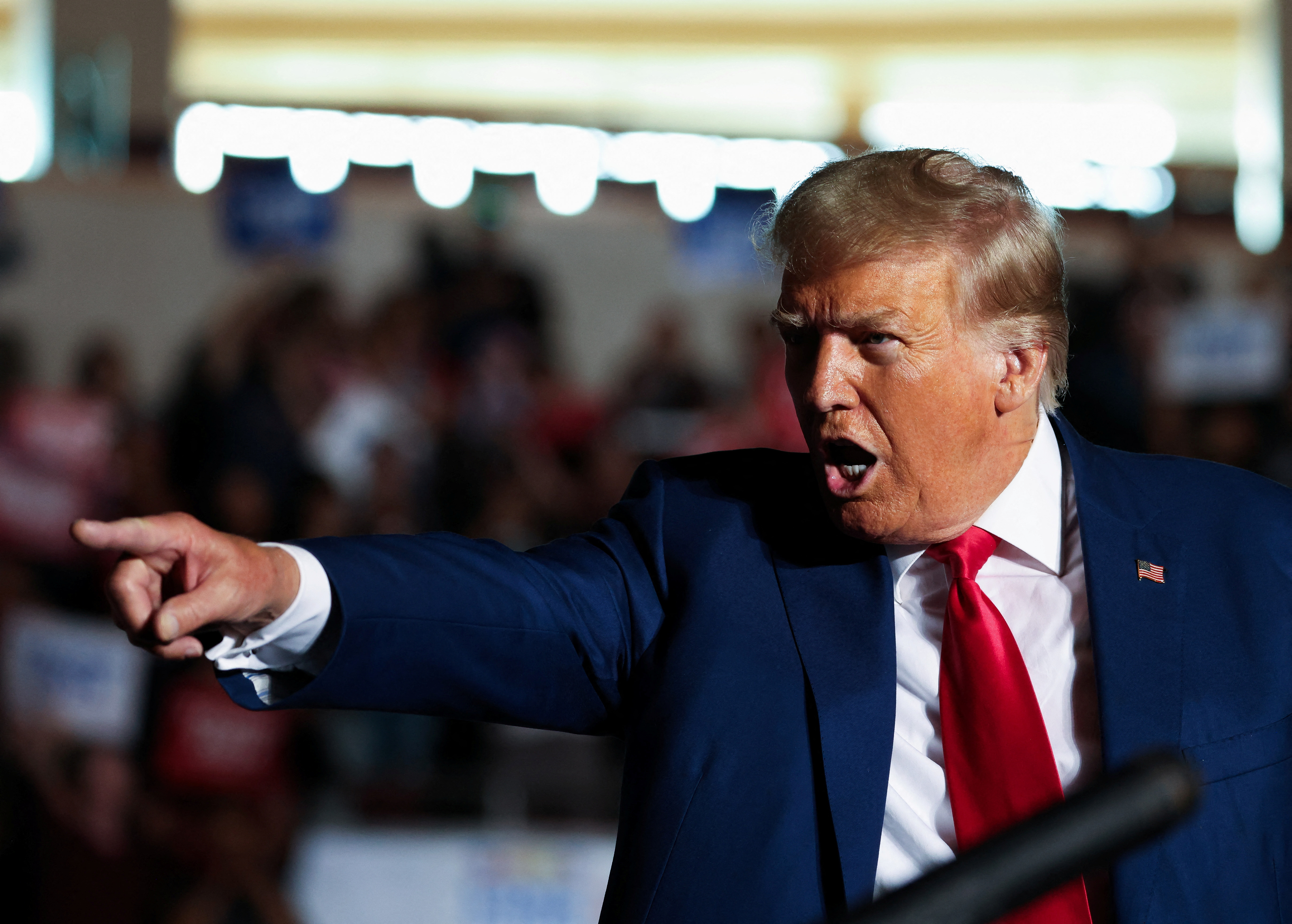 Former U.S. President and Republican presidential candidate Donald Trump points and speaks during a campaign rally in Erie, Pennsylvania, U.S., July 29, 2023.