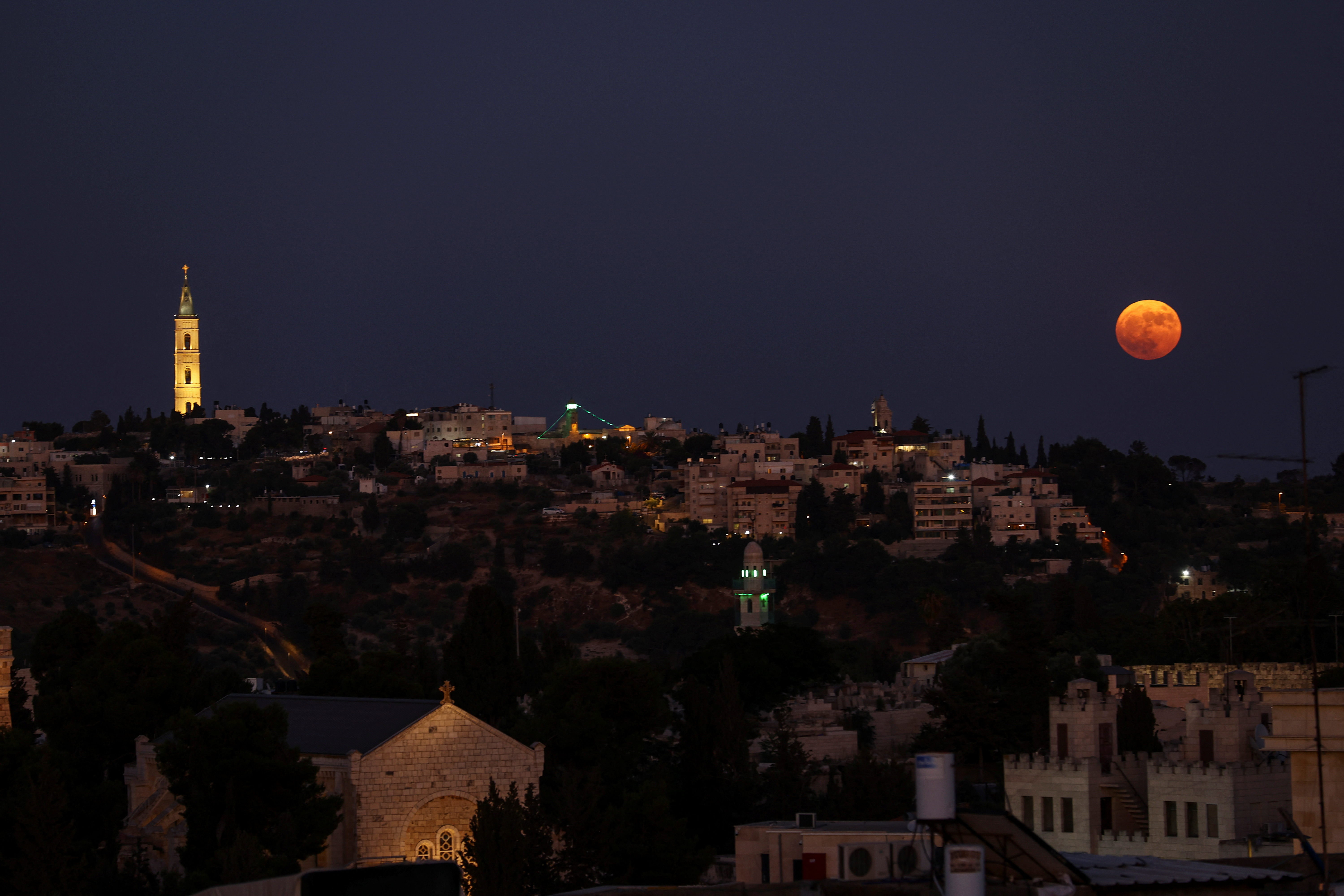 A supermoon, also known as a Sturgeon moon rises over Jerusalem