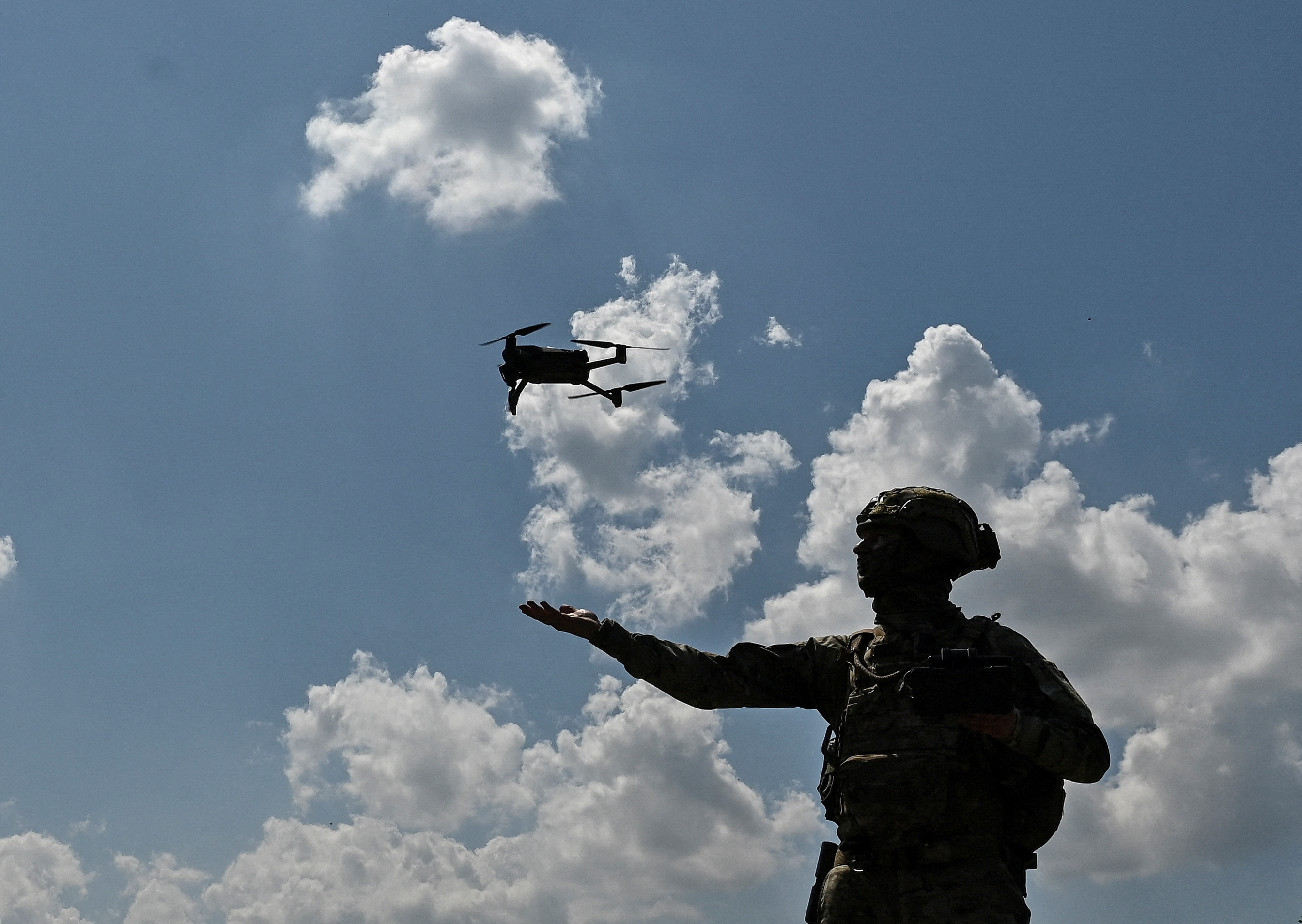 A Ukrainian serviceman of 108th separate territorial defence brigade of the Armed Forces of Ukraine launches a drone near a frontline, amid Russia's attack on Ukraine, in Zaporizhzhia region, Ukraine August 4, 2023. REUTERS/Stringer TPX IMAGES OF THE DAY