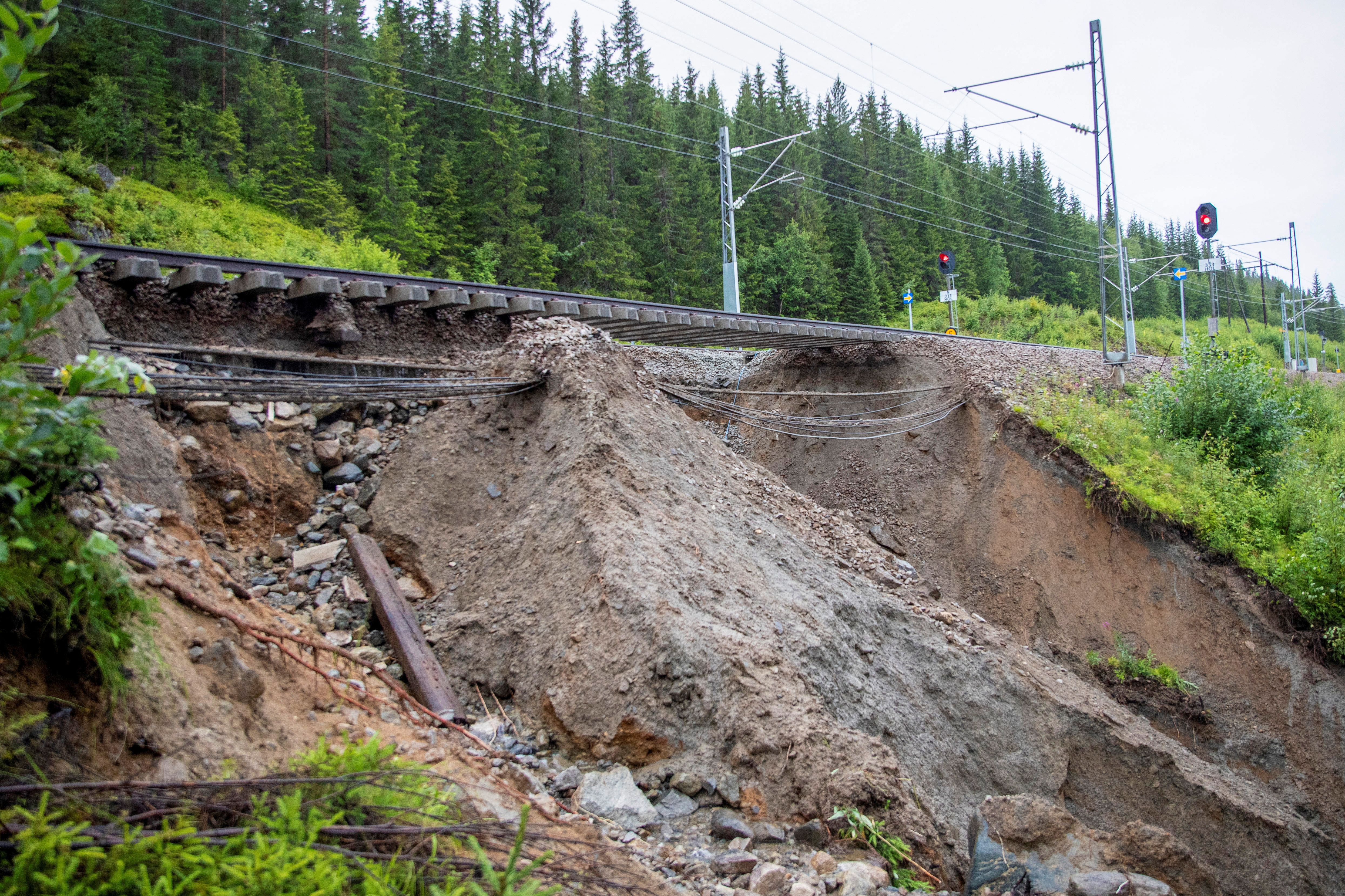 Parts of the Bergen Line are damaged following the extreme weather "Hans", in Hole, Norway August 9, 2023. NTB/Frederik Ringnes via REUTERS ATTENTION EDITORS - THIS IMAGE WAS PROVIDED BY A THIRD PARTY. NORWAY OUT. NO COMMERCIAL OR EDITORIAL SALES IN NORWAY.