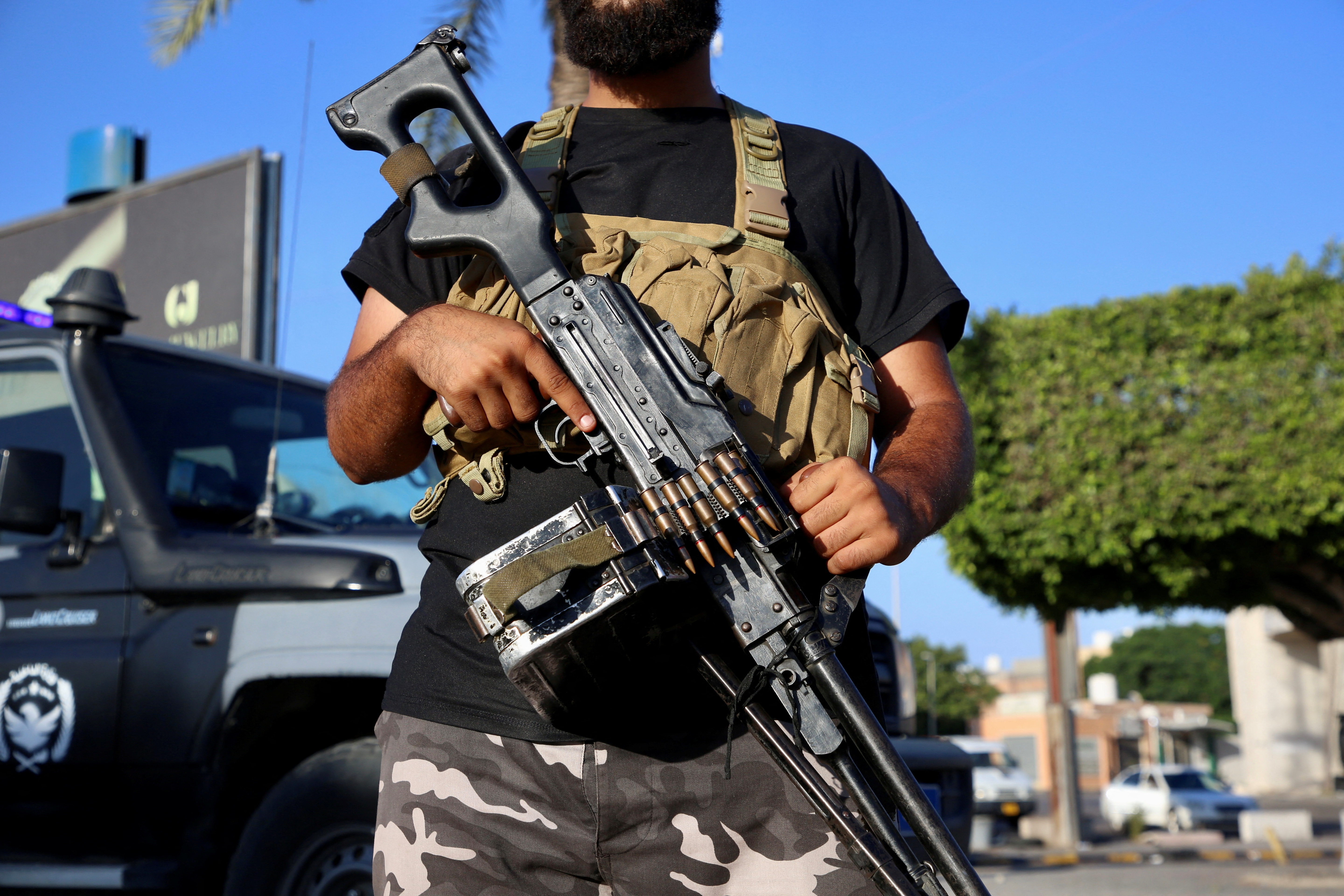 close up of man holding gun