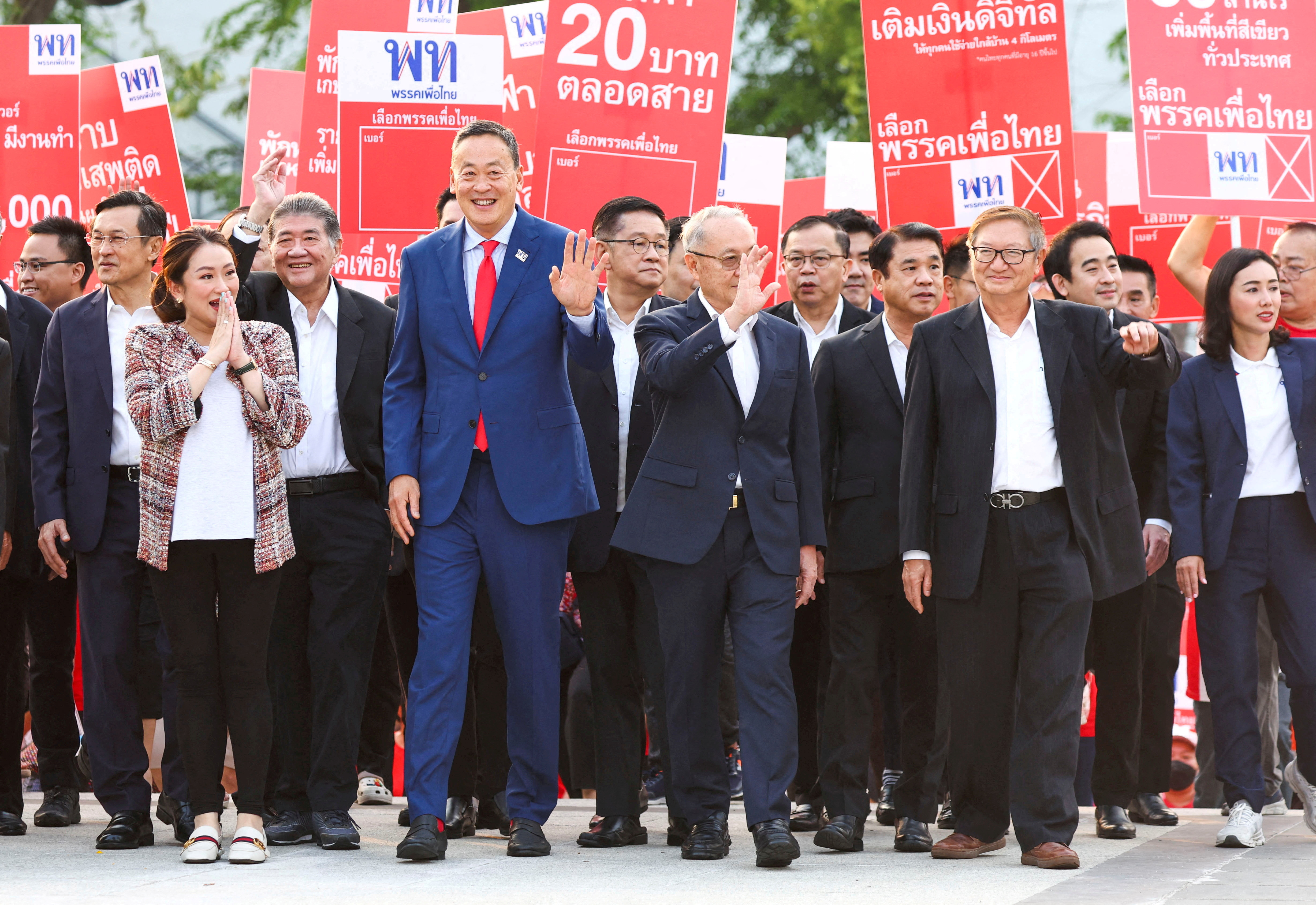 Srettha Thavisin, a local property tycoon and Pheu Thai Party's new adviser, and Paetongtarn Shinawatra, daughter of former Prime Minister Thaksin Shinawatra, both lined up as Pheu Thai Party's prime ministerial candidates, arrive before the draw for the party's list usage for the upcoming election ahead an event by the election commission in Bangkok, Thailand, April 4, 2023.