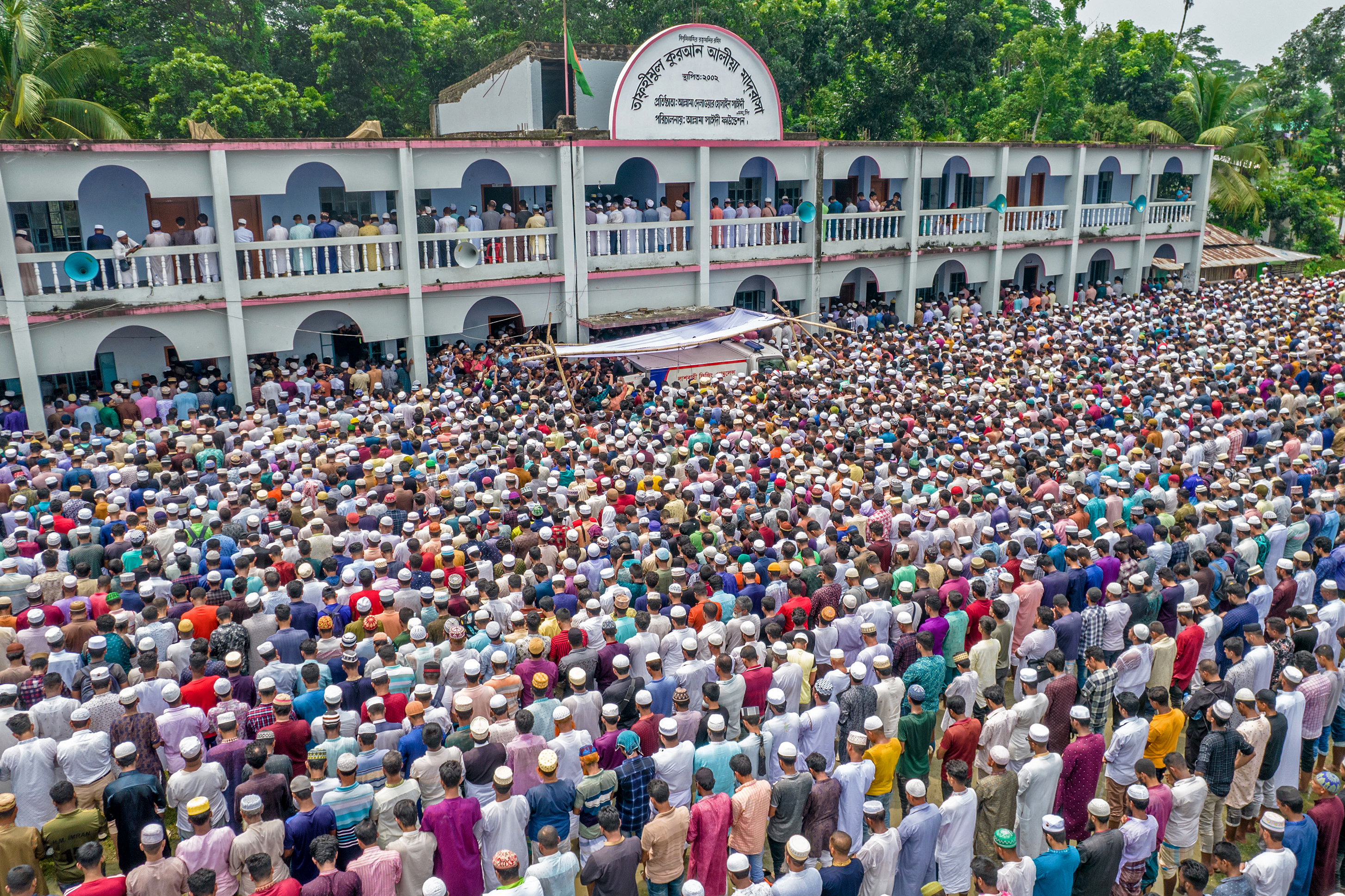 This aerial photo shows supporters of Islamist leader Delwar Hossain Sayedee, gathered to offer prayers during his funeral at Pirojpur district