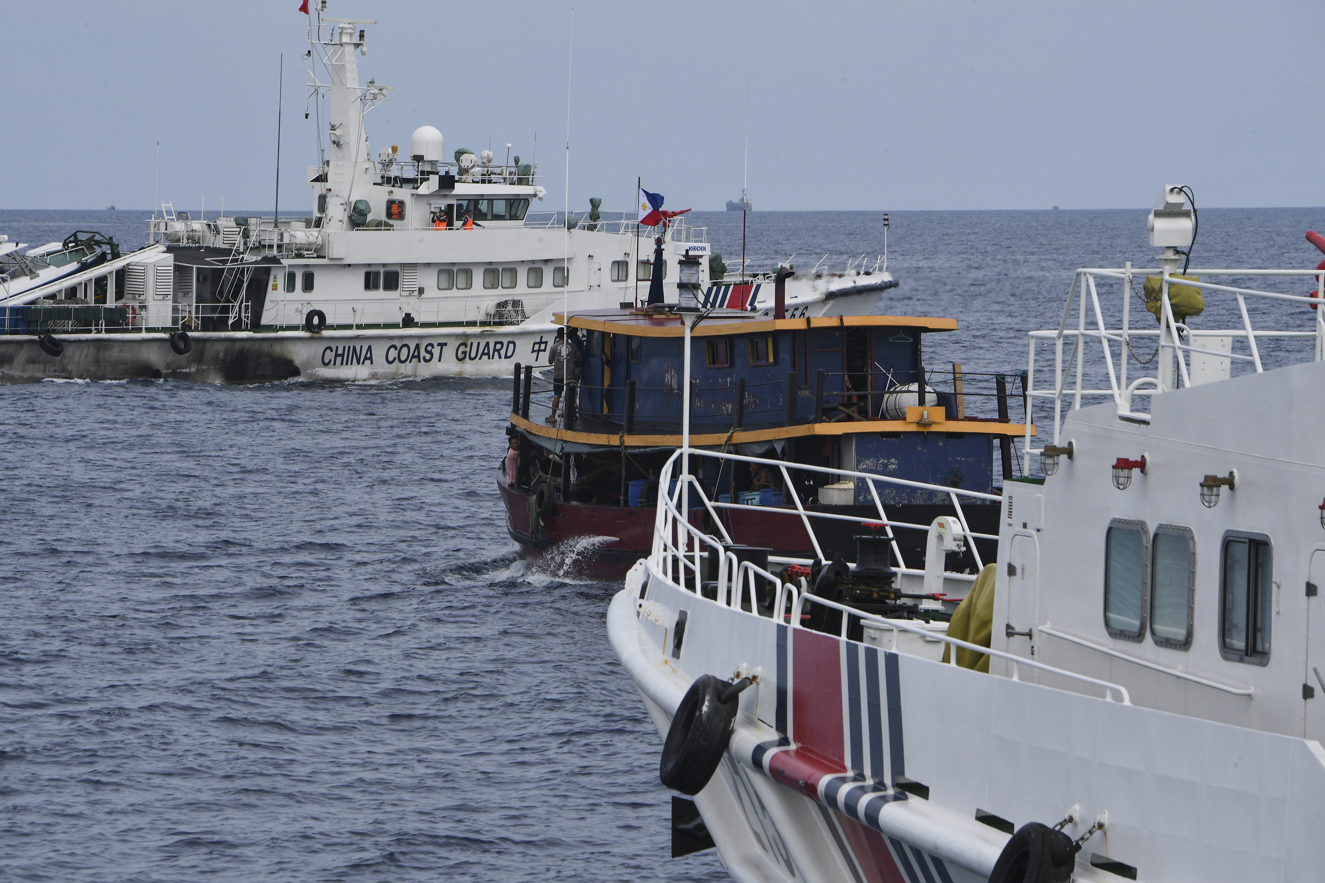 Chinese Coast Guard ships box in one of the Philippines' supply ships
