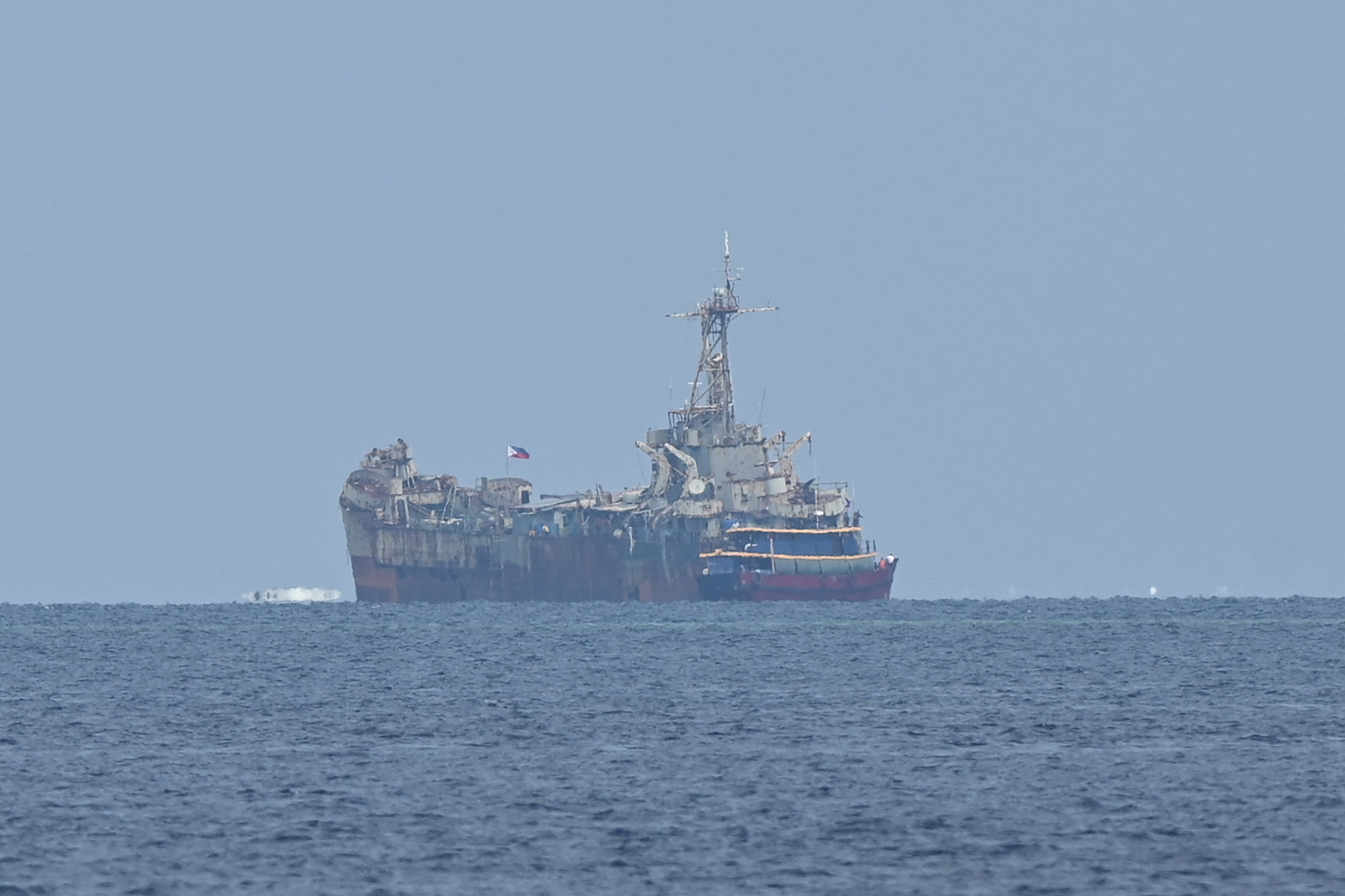 The grounded Sierra Madre seen through haze from a distance
