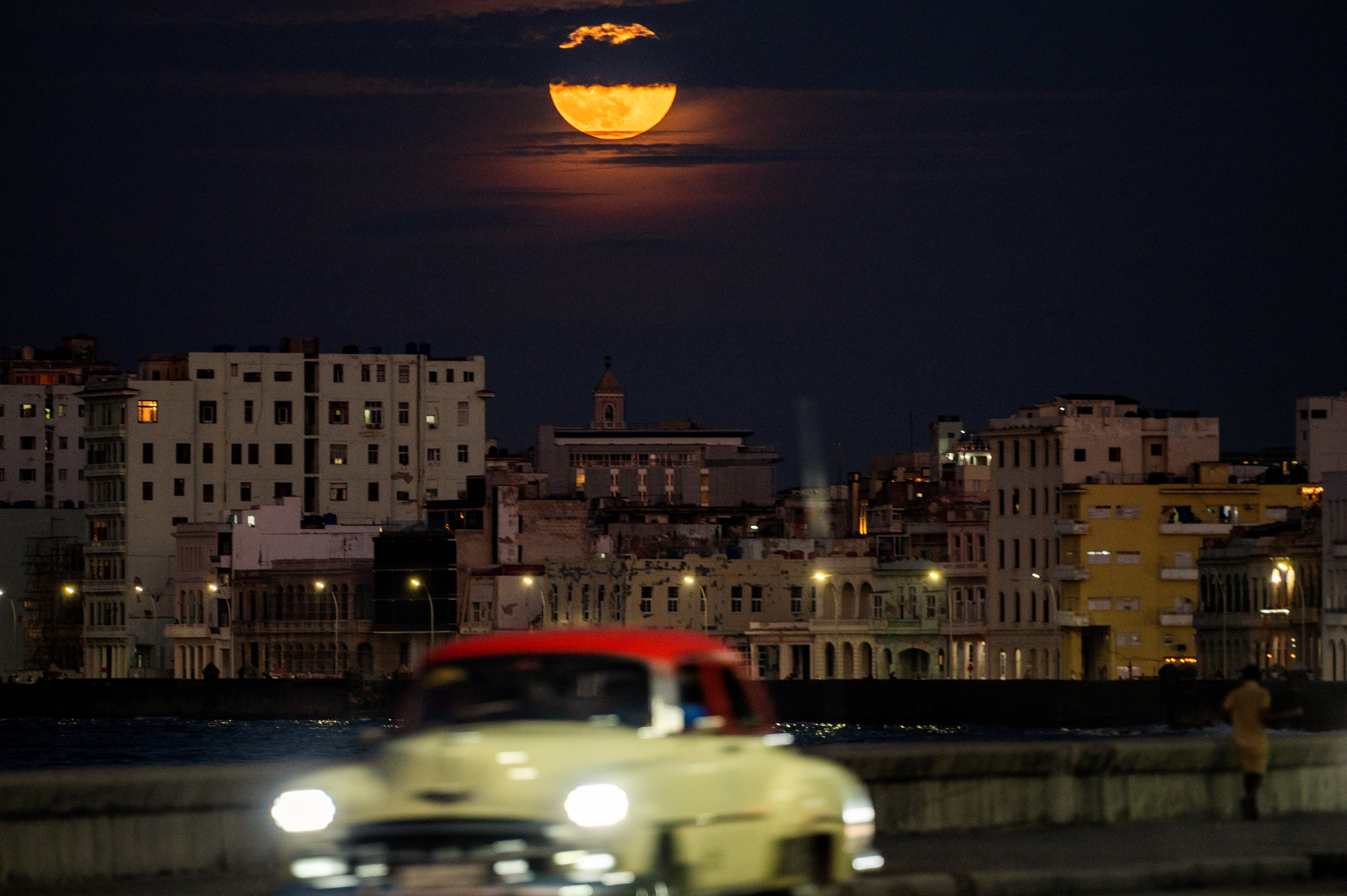 The "Blue Supermoon", the second full moon of a calendar month, rises over Havana