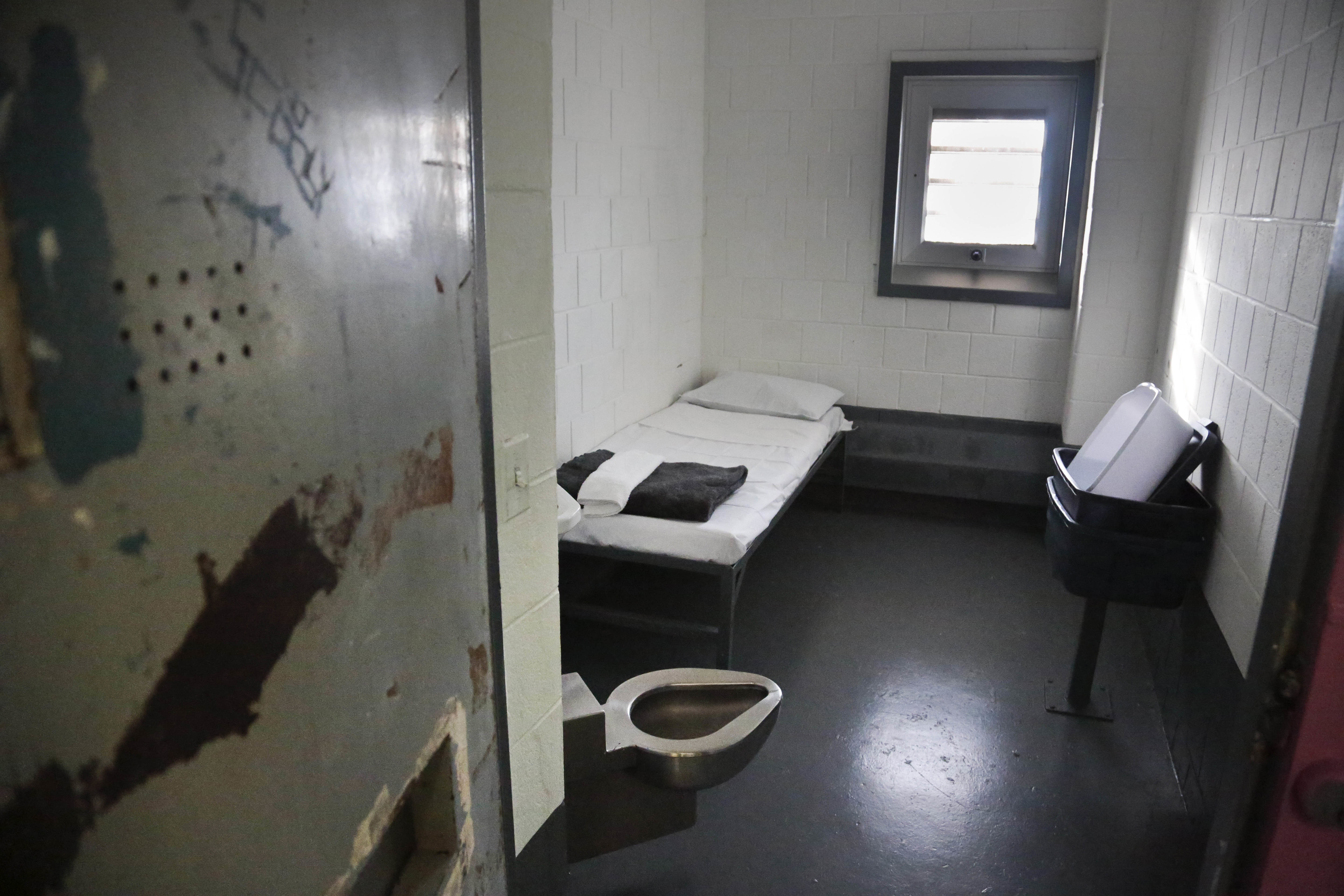 FILE - This Jan. 28, 2016 file photo shows a solitary confinement cell at New York City's Riker's Island jail. On Thursday, March 31, 2016, a federal judge approved a sweeping plan to reduce solitary confinement in New York state prisons. (AP Photo/Bebeto Matthews, File)