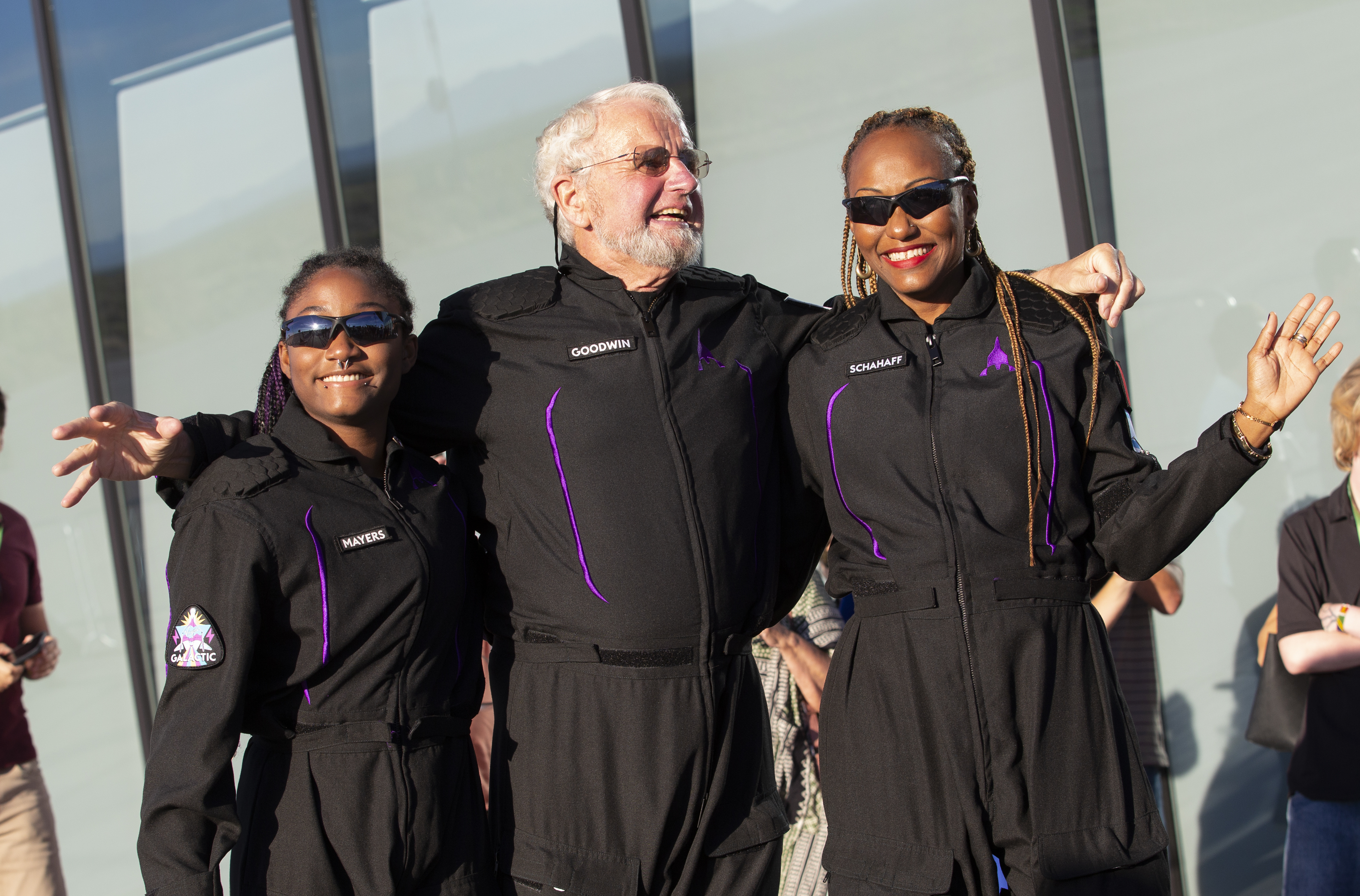 Space tourists, from left, Anastatia Mayers, Jon Goodwin and Keisha Schahaff pose for photos before boarding their Virgin Galactic flight at Spaceport America, near Truth or Consequences, N.M., US