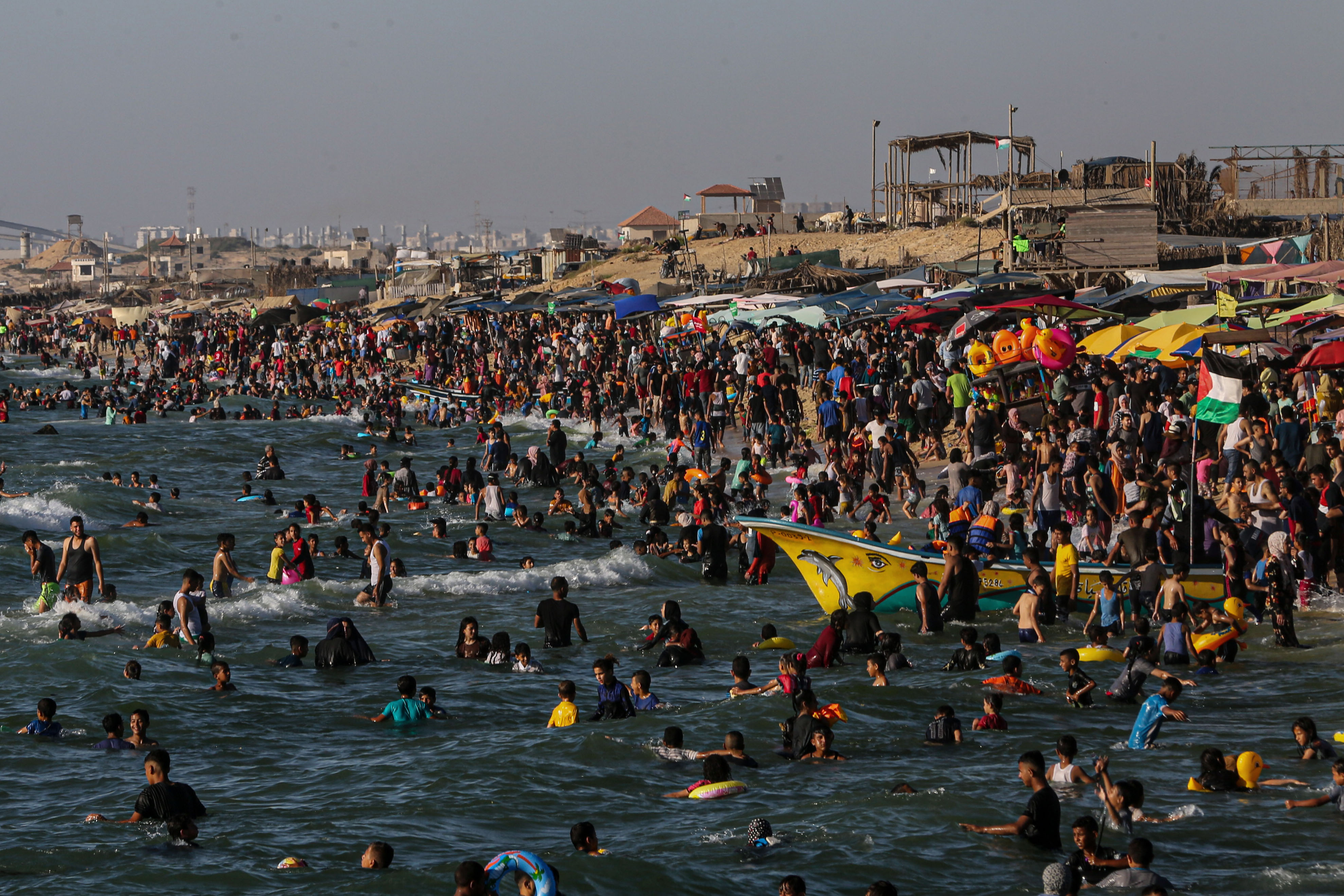a crowd of people on the beach